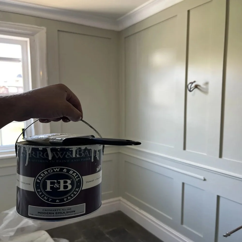 Close-up of bathroom renovation in Bebington showing freshly painted wall panelling using Farrow & Ball paint, with smooth finished panels and neutral tones ready for final fixture installation