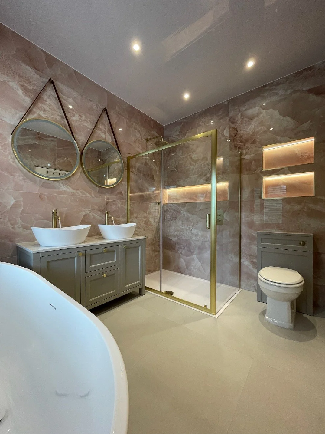 Pink tiled Bathroom renovation with hanging wall mirrors