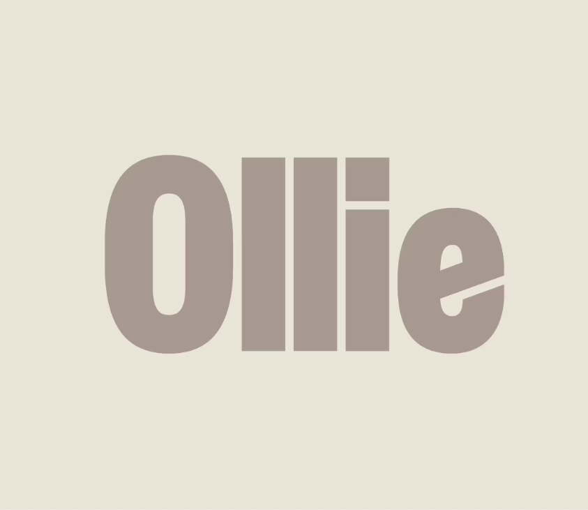 The word 'Ollie' in large, light brown text on a light beige background.