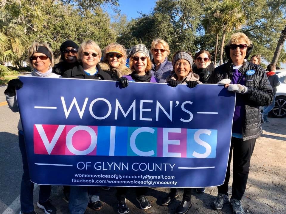 Women marching at a local rally.