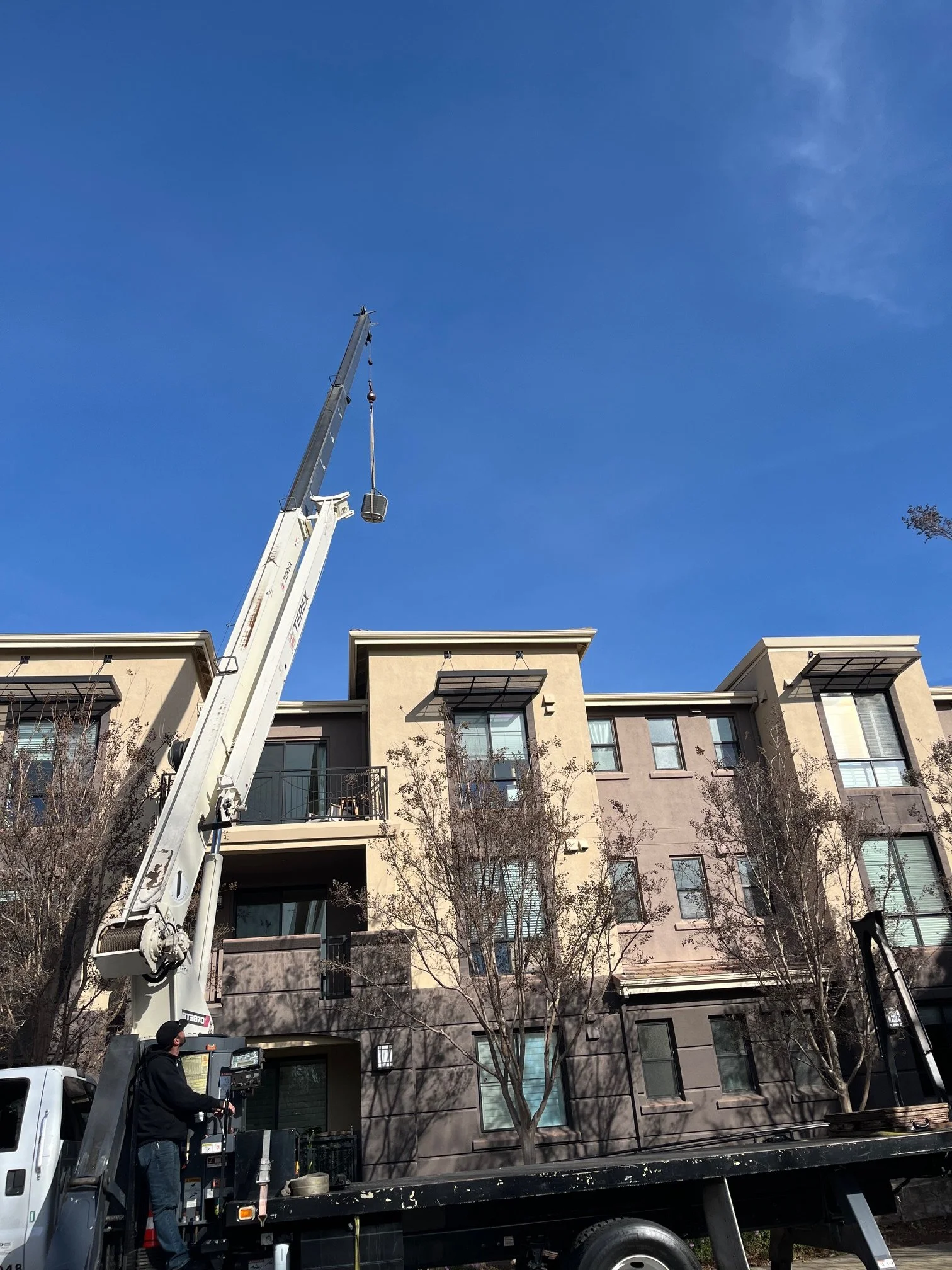 Installation of system on roof using crane