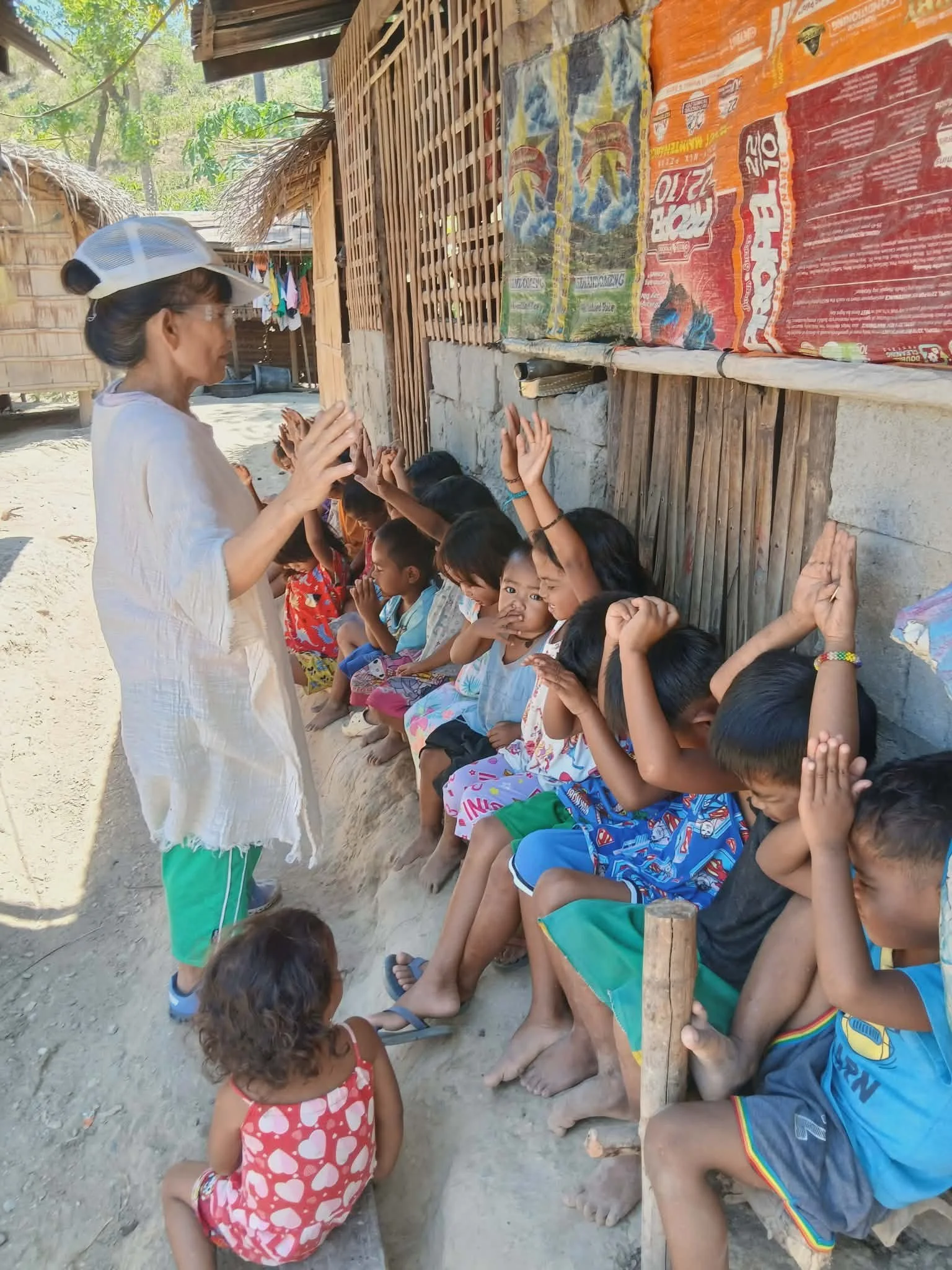 A woman evangelizing to children