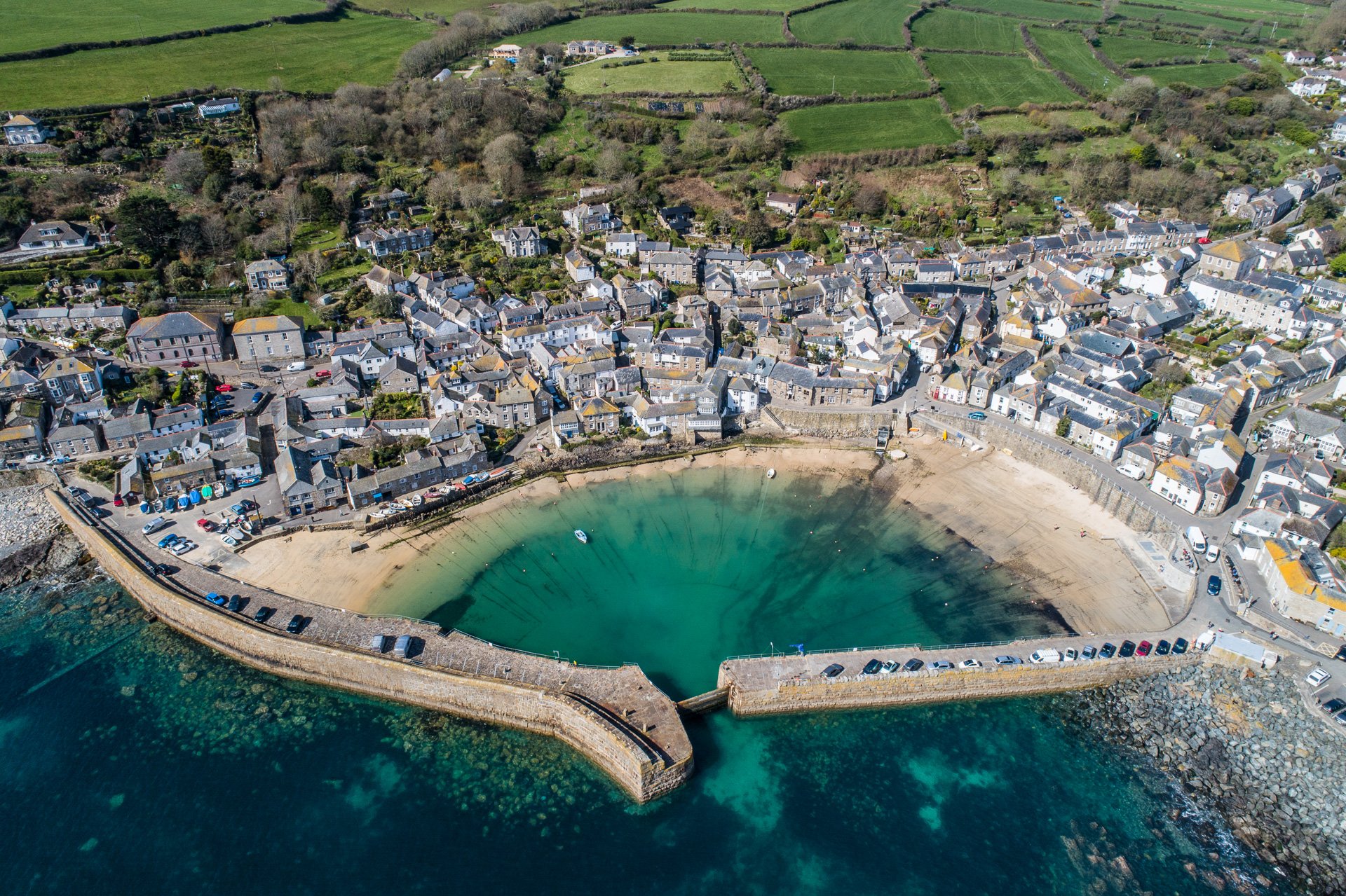 Mousehole harbour and village.