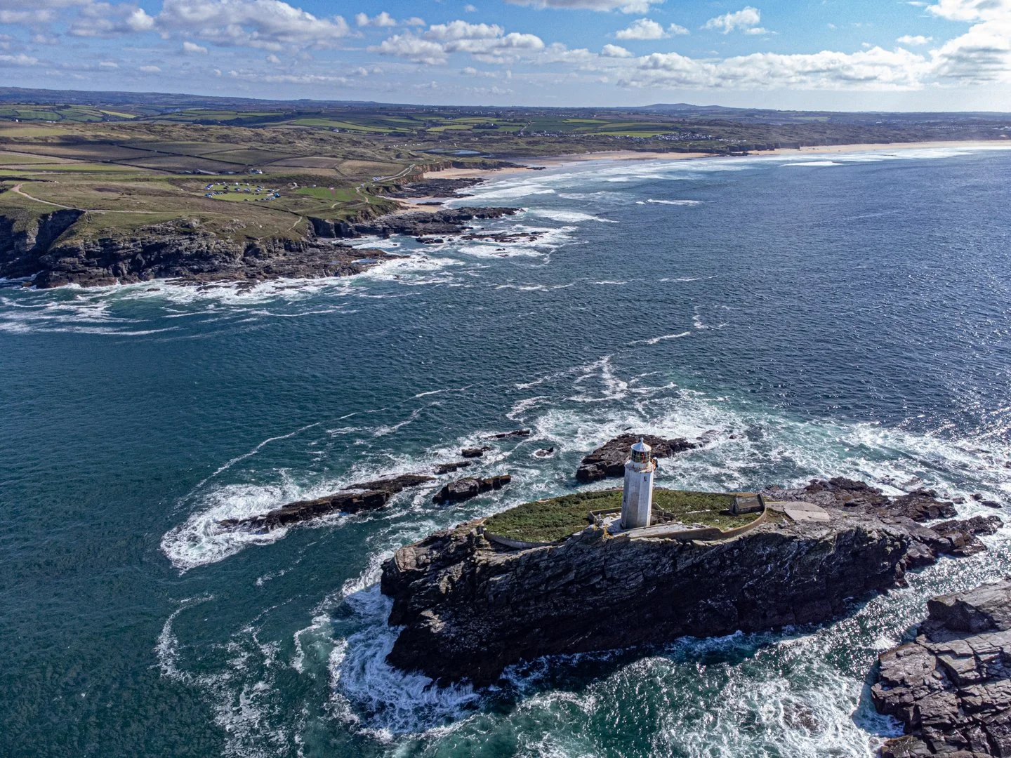 Over the lighthouse to Godrevy beach and Gwithian in the distance
