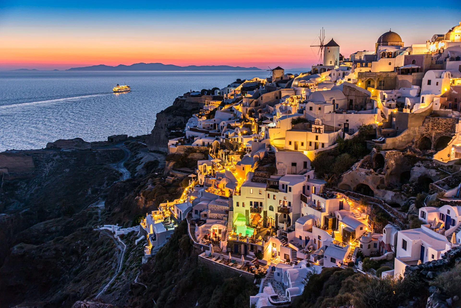 Thousands of people gather here at Oia every evening to watch the sun set. Then when it goes down below the horizon they all clap as if it's never done this before.