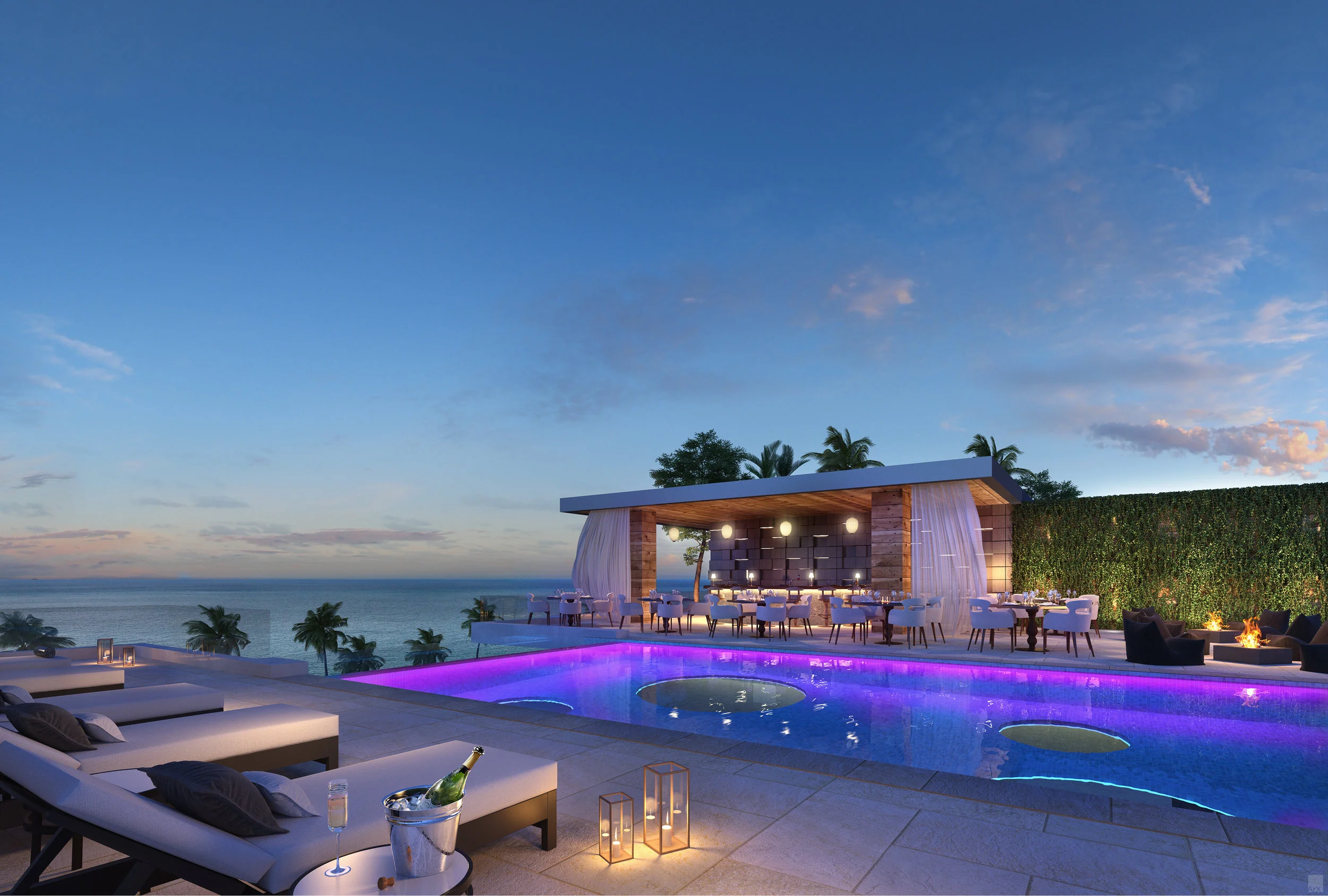 Luxury outdoor pool area with seating, deck chairs with cushions, and a view of the ocean at sunset, featuring a modern open-air pavilion with dining area and string lights, surrounded by palm trees and greenery.