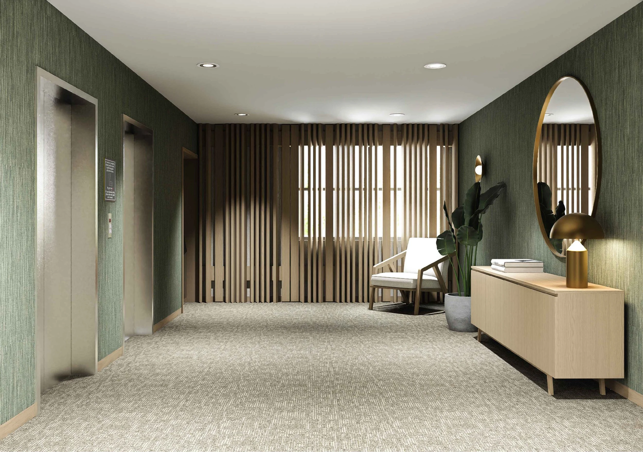 Hotel lobby featuring elevator doors on the left, a seating area with a white armchair, a tan-colored side table with a gold lamp, a large mirror, a potted plant, and wooden decorative wall panels in the background.