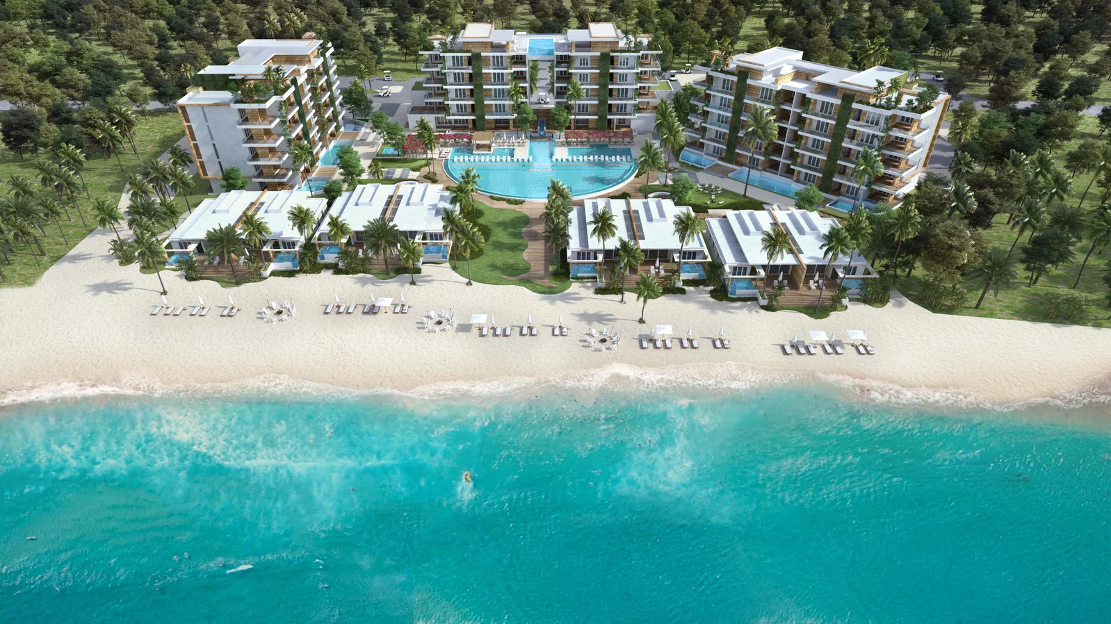 Aerial view of a beachfront resort with multiple modern buildings, pools, palm trees, and sandy beach with lounge chairs and umbrellas, overlooking the ocean.