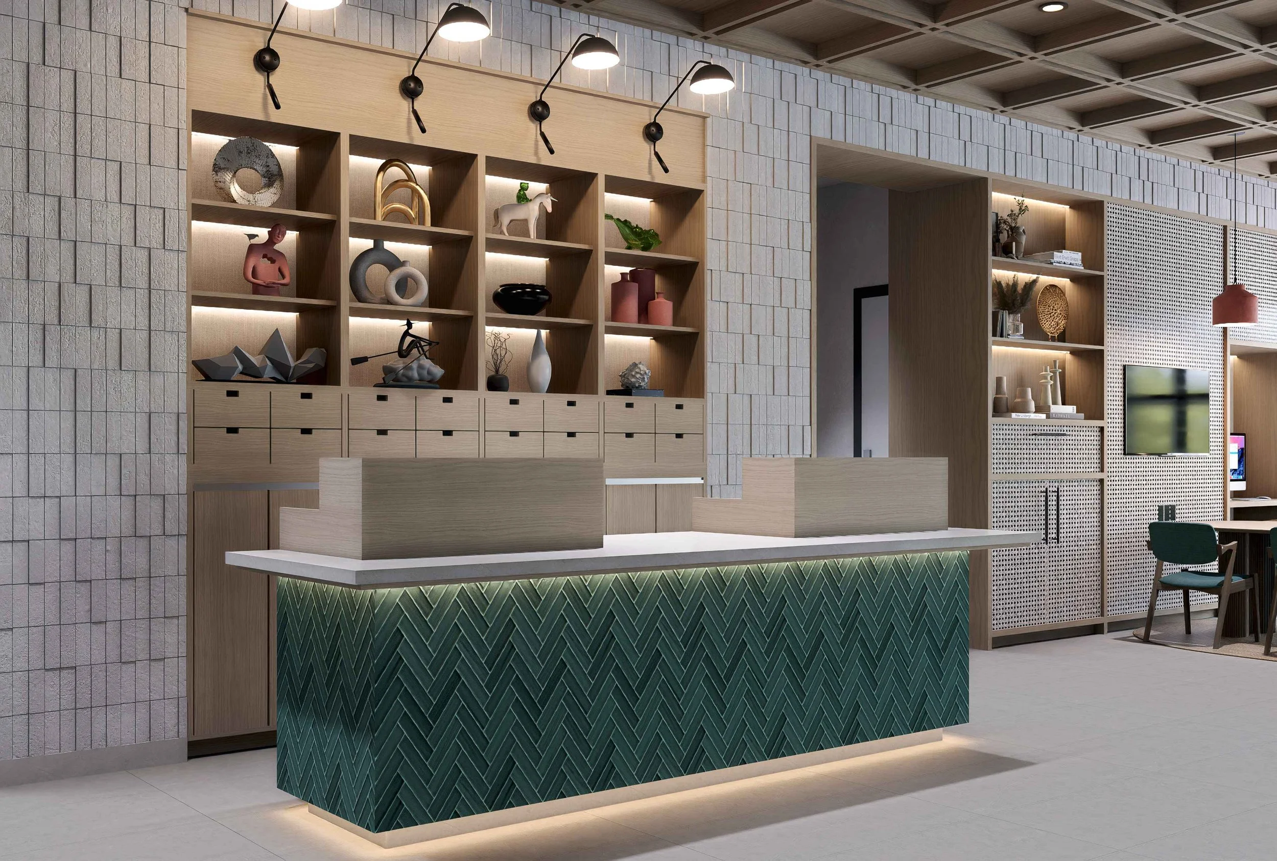 Modern interior space with a wooden reception desk featuring green tile accents and open wooden shelving displaying decorative objects, plants, and books, with wall lighting and a coffered ceiling.