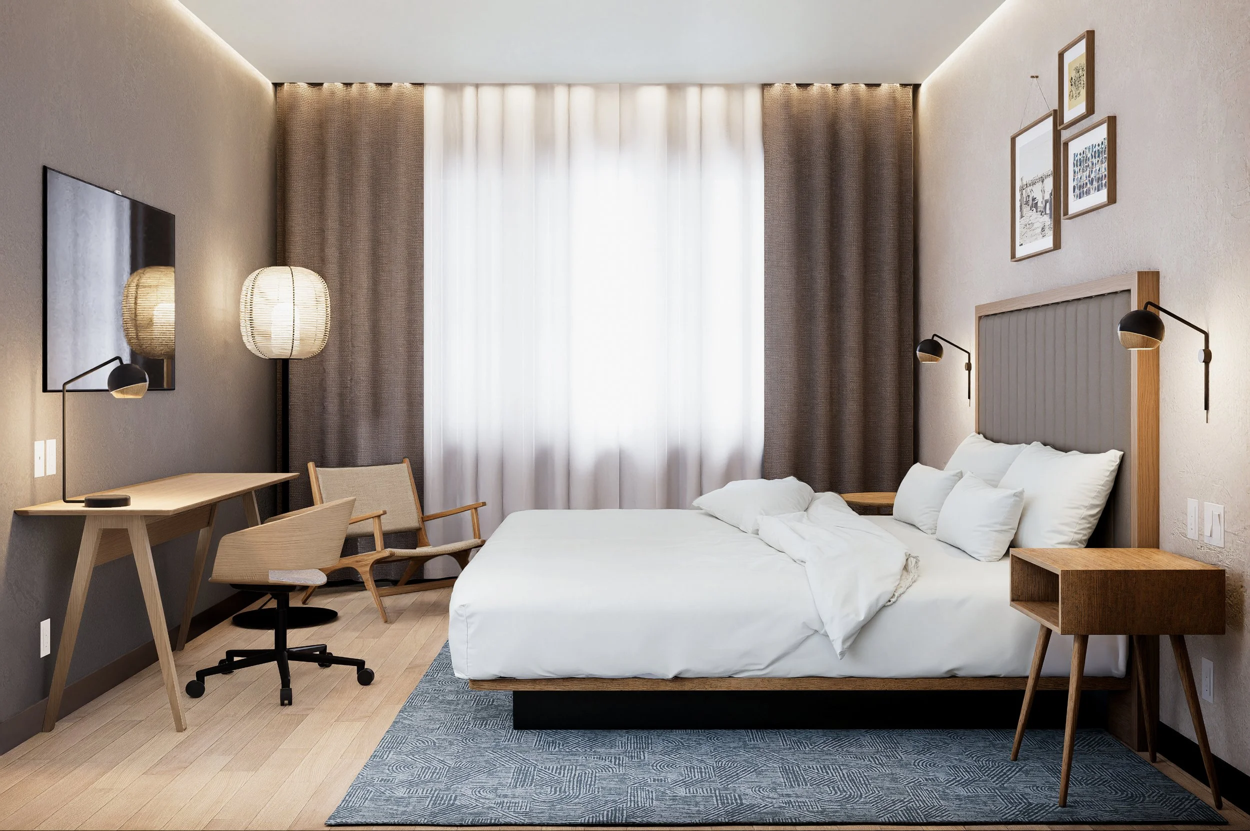 A modern hotel room with a queen-sized bed, bedside tables, and wall-mounted reading lights. There is a flat-screen TV on the wall, a desk with an office chair, and framed pictures hanging on the wall. The room has a large window with white and brown curtains, and the flooring is wood with a blue area rug.
