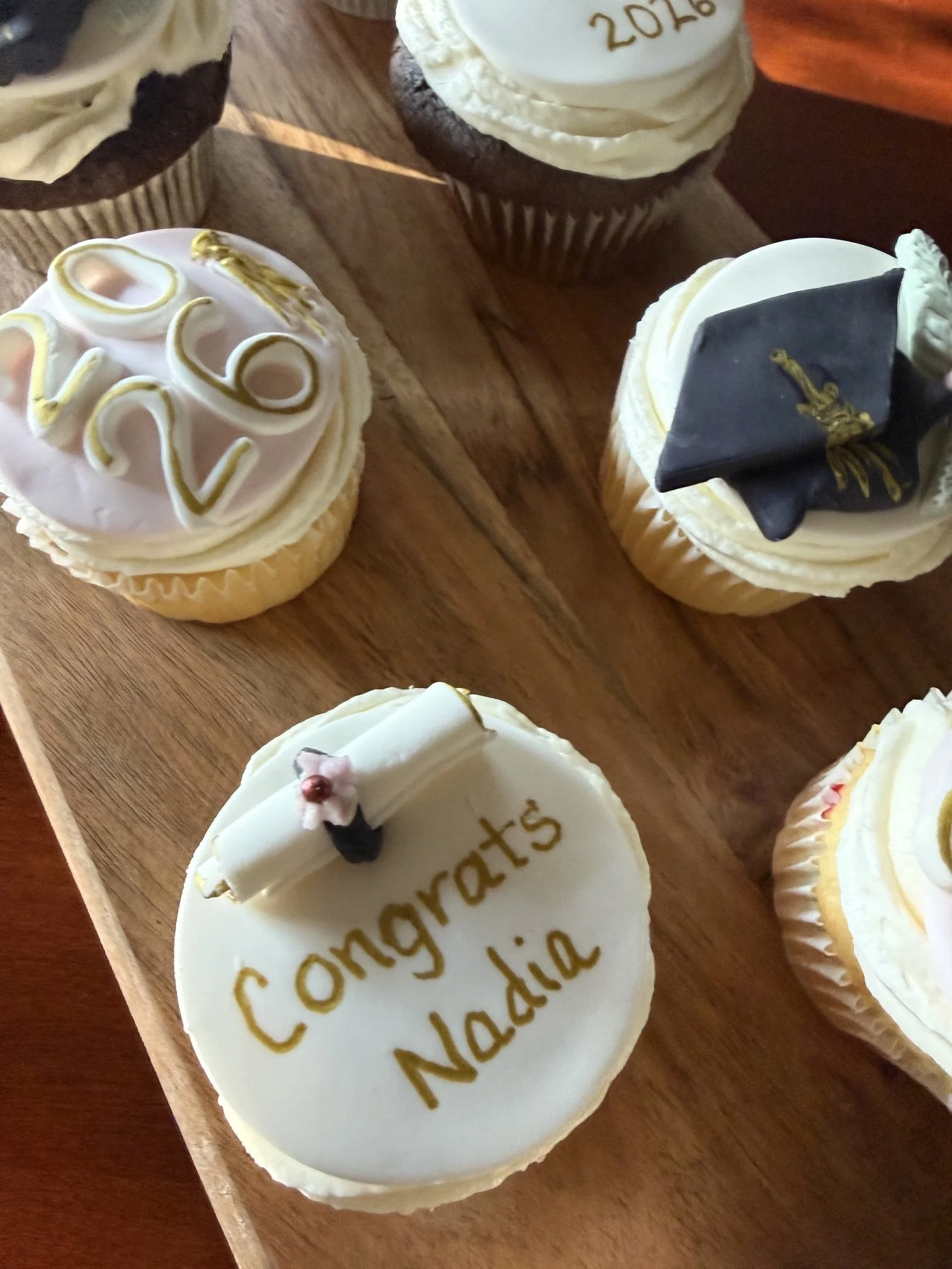 Graduation caps, diplomas, and year cupcakes