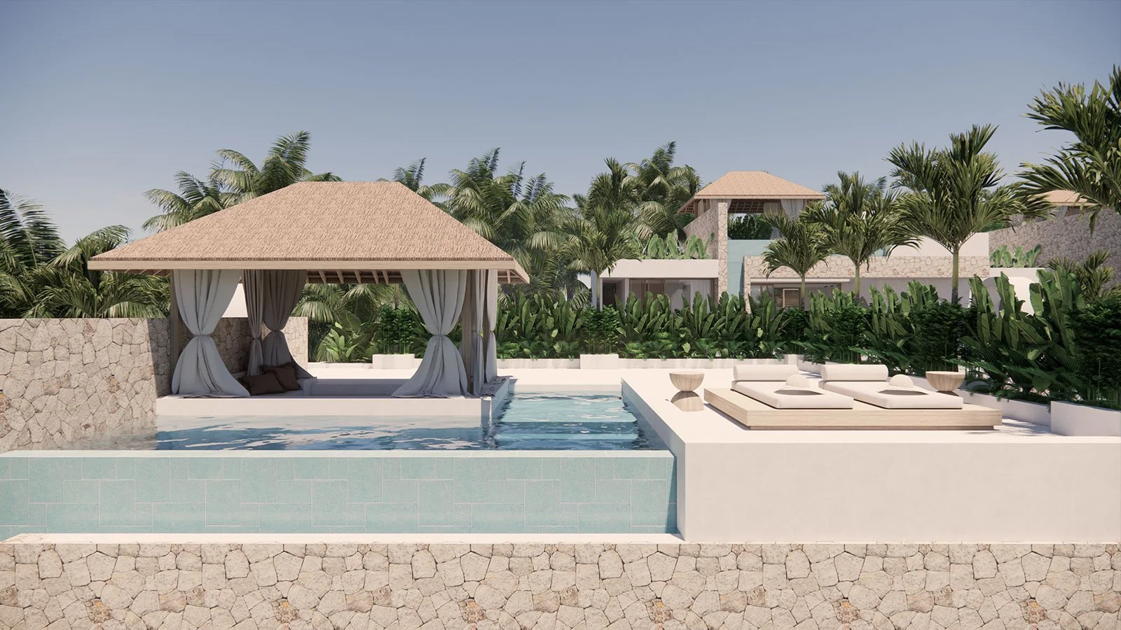 Luxury pool area with a cabana with white curtains, sun loungers, lush green tropical plants, and modern buildings in the background.