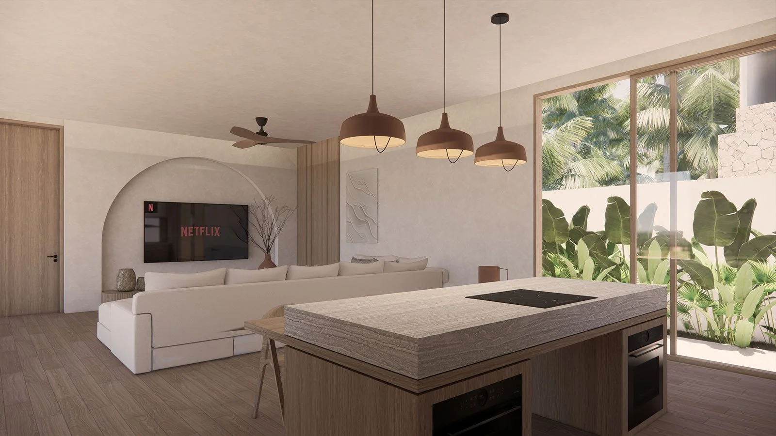 Modern living room with a large white sofa, wall-mounted TV showing Netflix, and a kitchen island with a built-in stove, surrounded by glass sliding doors opening to lush greenery outside.