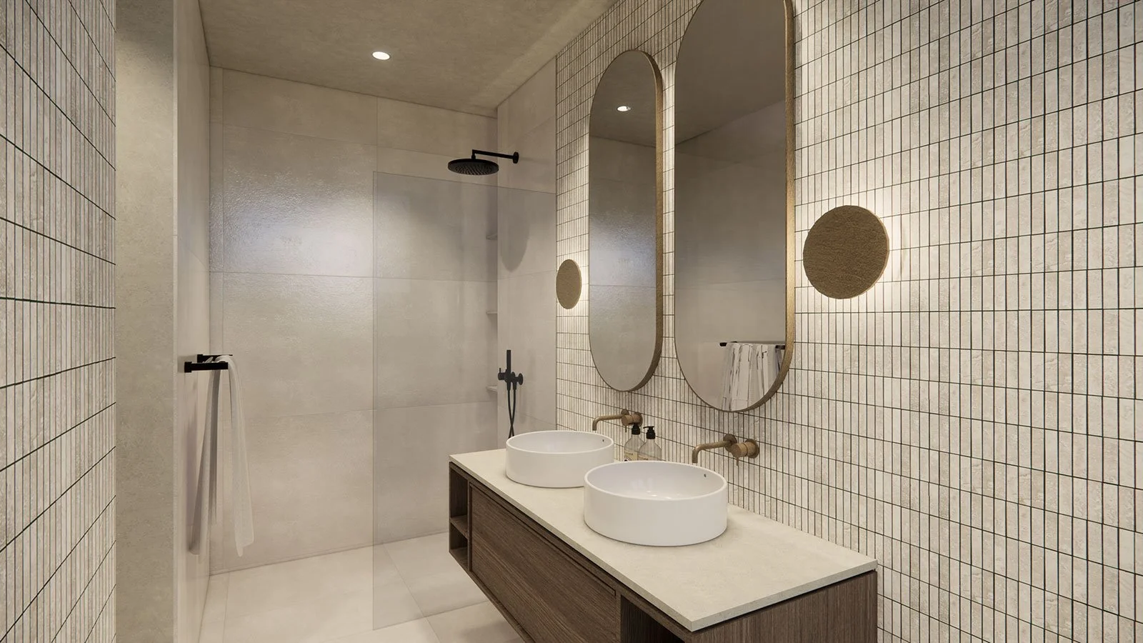 Modern bathroom with two oval mirrors, double sinks, tiled walls, glass shower door, and minimalist decor.