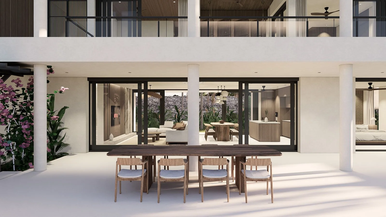 Modern white multi-story house with large glass sliding doors, outdoor dining table with six chairs, and interior living space with couches, plants, and lighting.