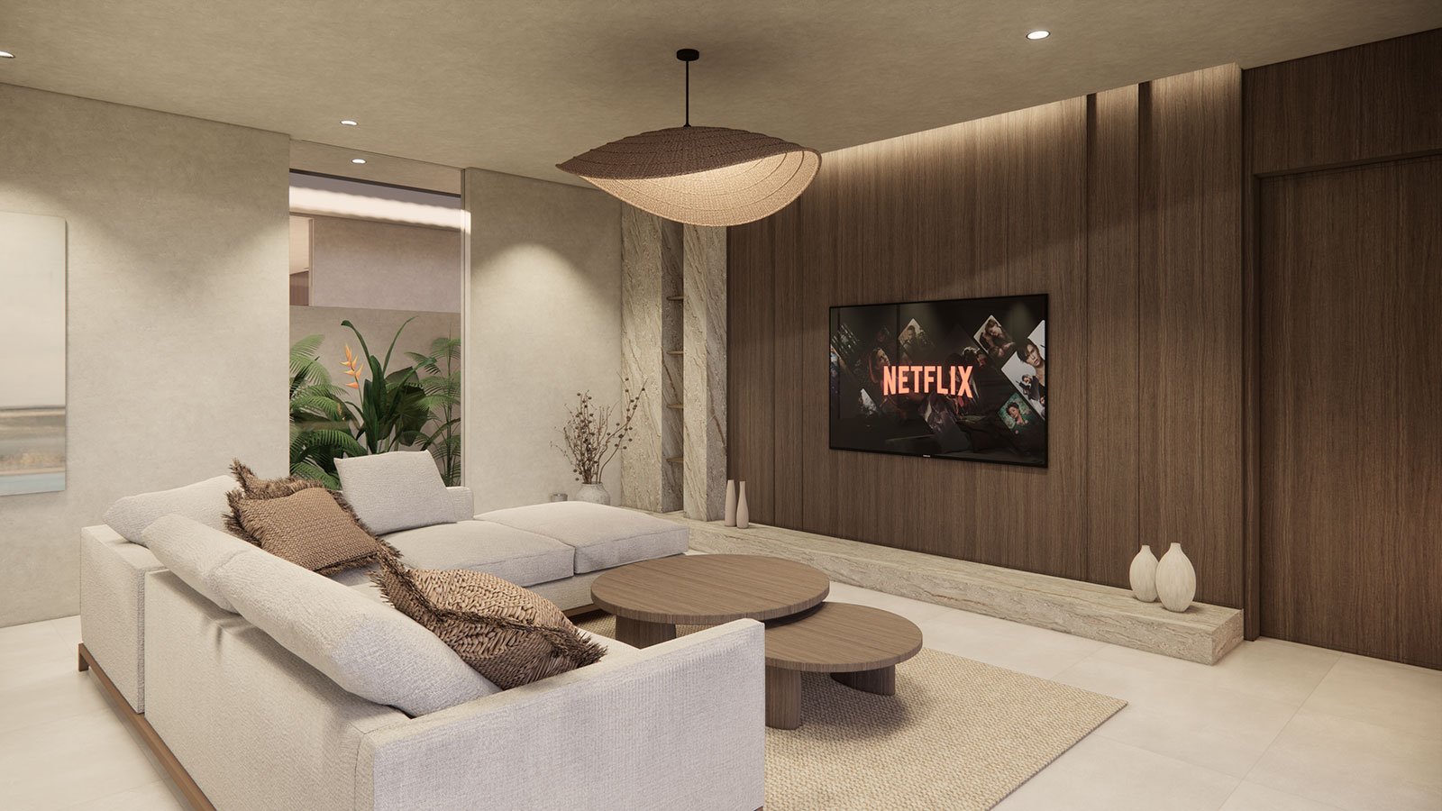 Modern living room with beige sectional sofa, twin round wooden coffee tables, and a wall-mounted TV displaying Netflix logo. Decor includes cushions, vases, and potted plants, with wood paneling and minimalist design.
