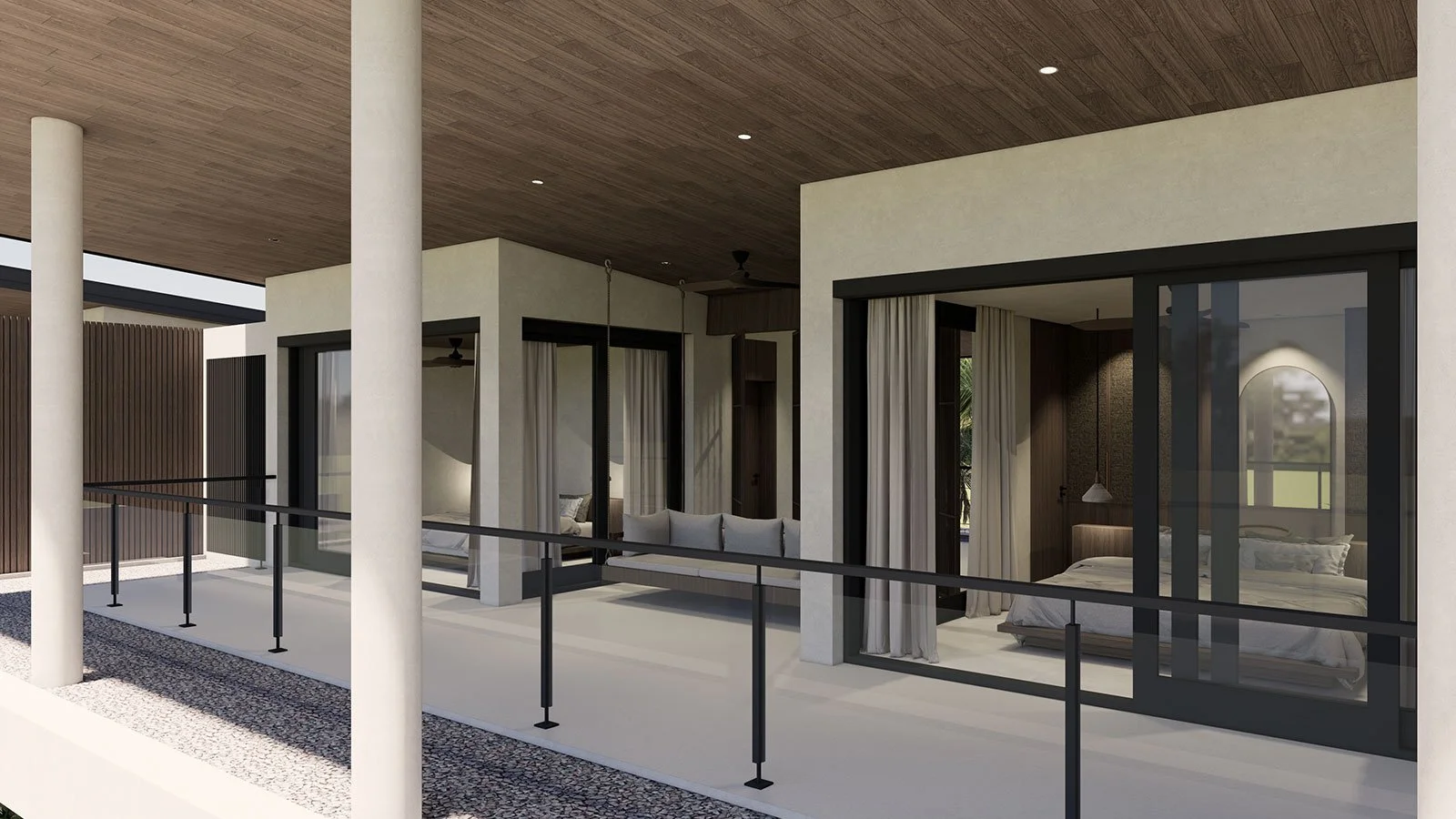 Modern balcony with glass sliding doors leading to bedrooms, outdoor seating, and a wood-paneled ceiling, supported by white columns.