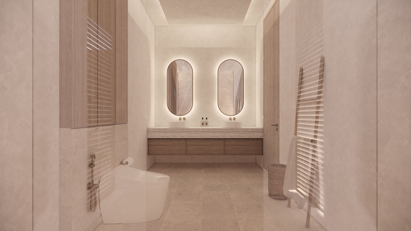 Modern bathroom with two oval mirrors backlit on the wall above a wooden vanity with two sinks. There is a white toilet on the left, a wicker basket on the right, and a white towel on a wooden towel ladder. The room is decorated in neutral tones.