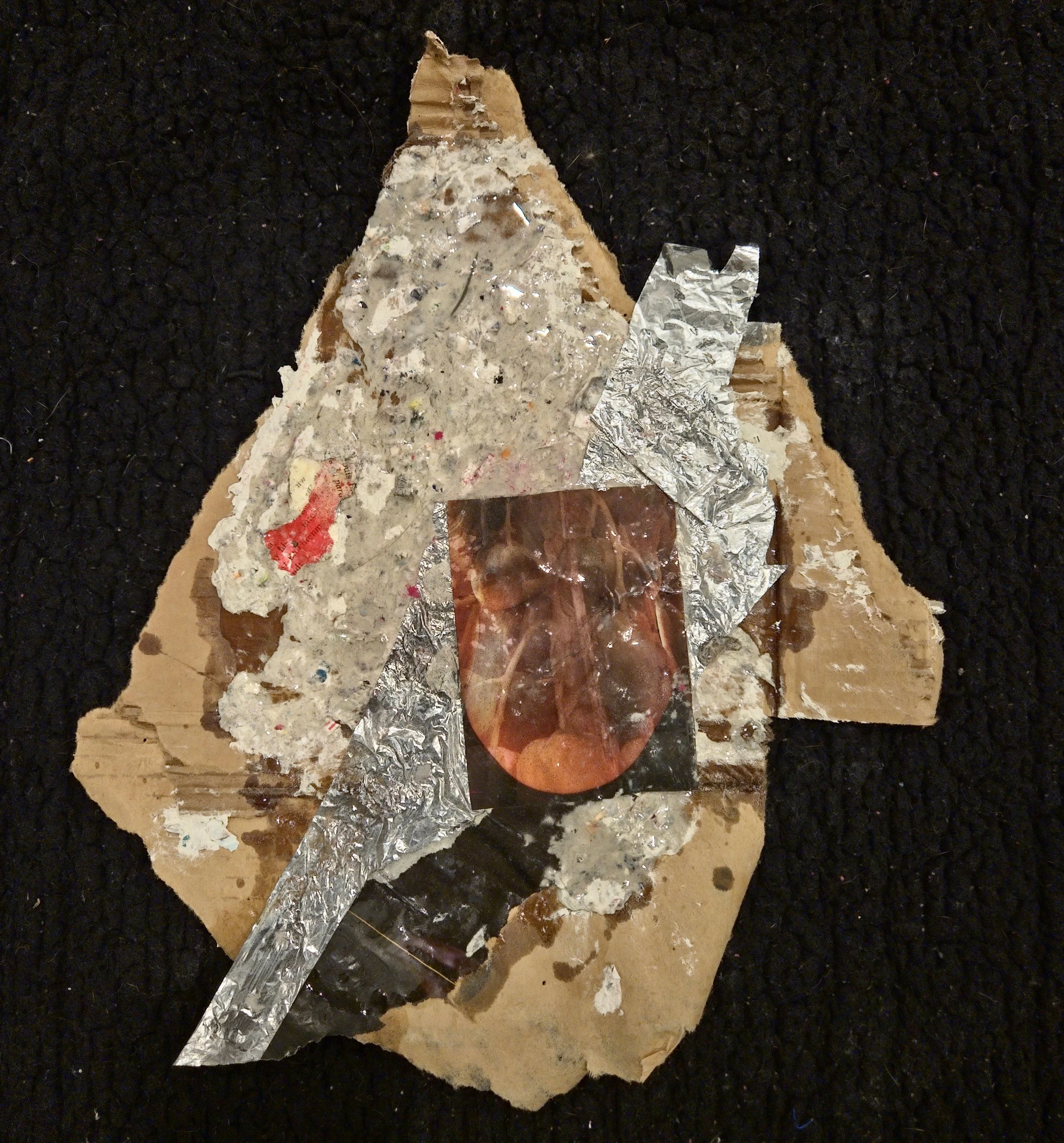 Mixed media artwork with torn textured paper, foil, and a photograph of a person's face with glasses on a black textured background.