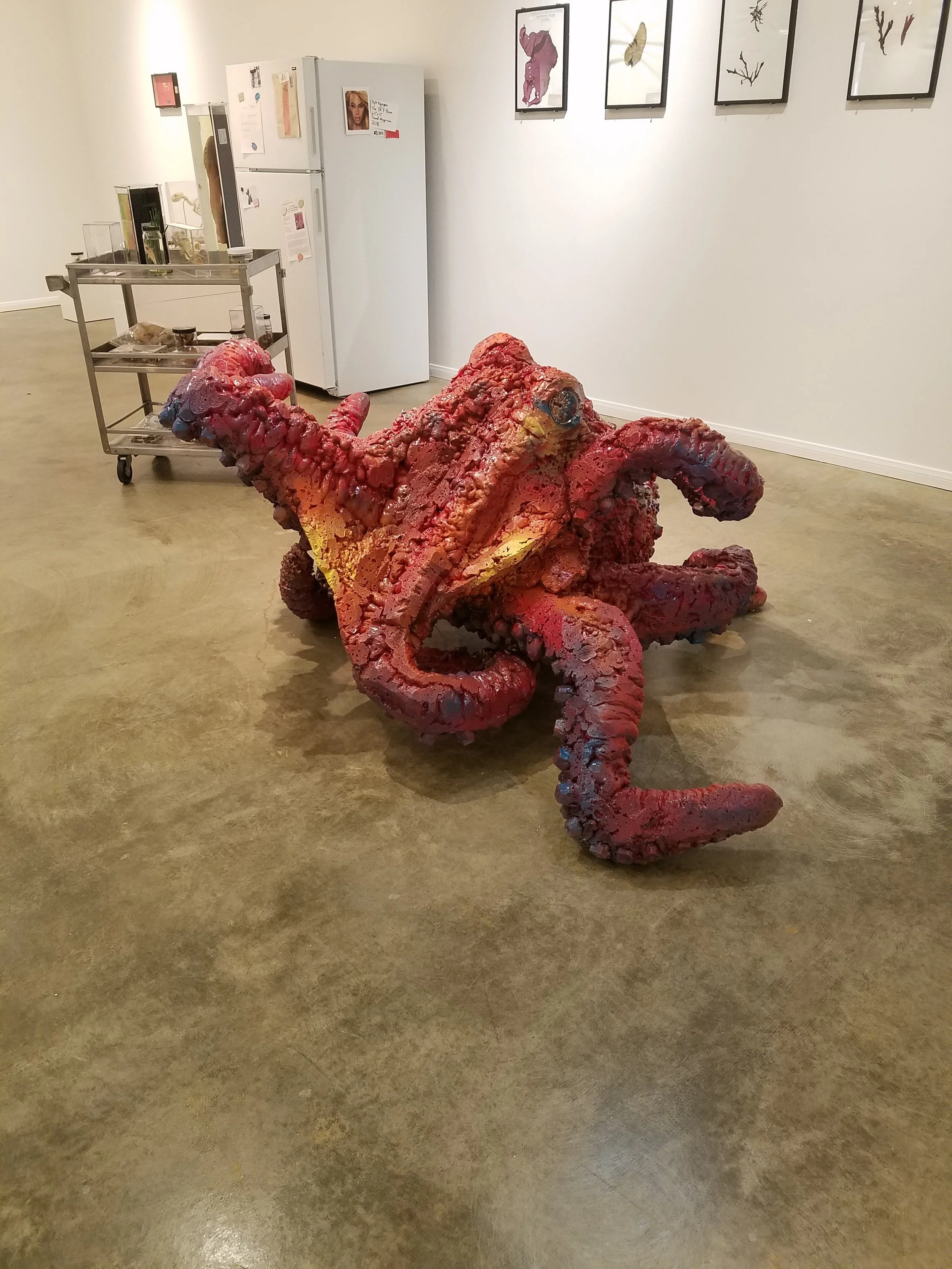 Octopus made out of find things and painted red