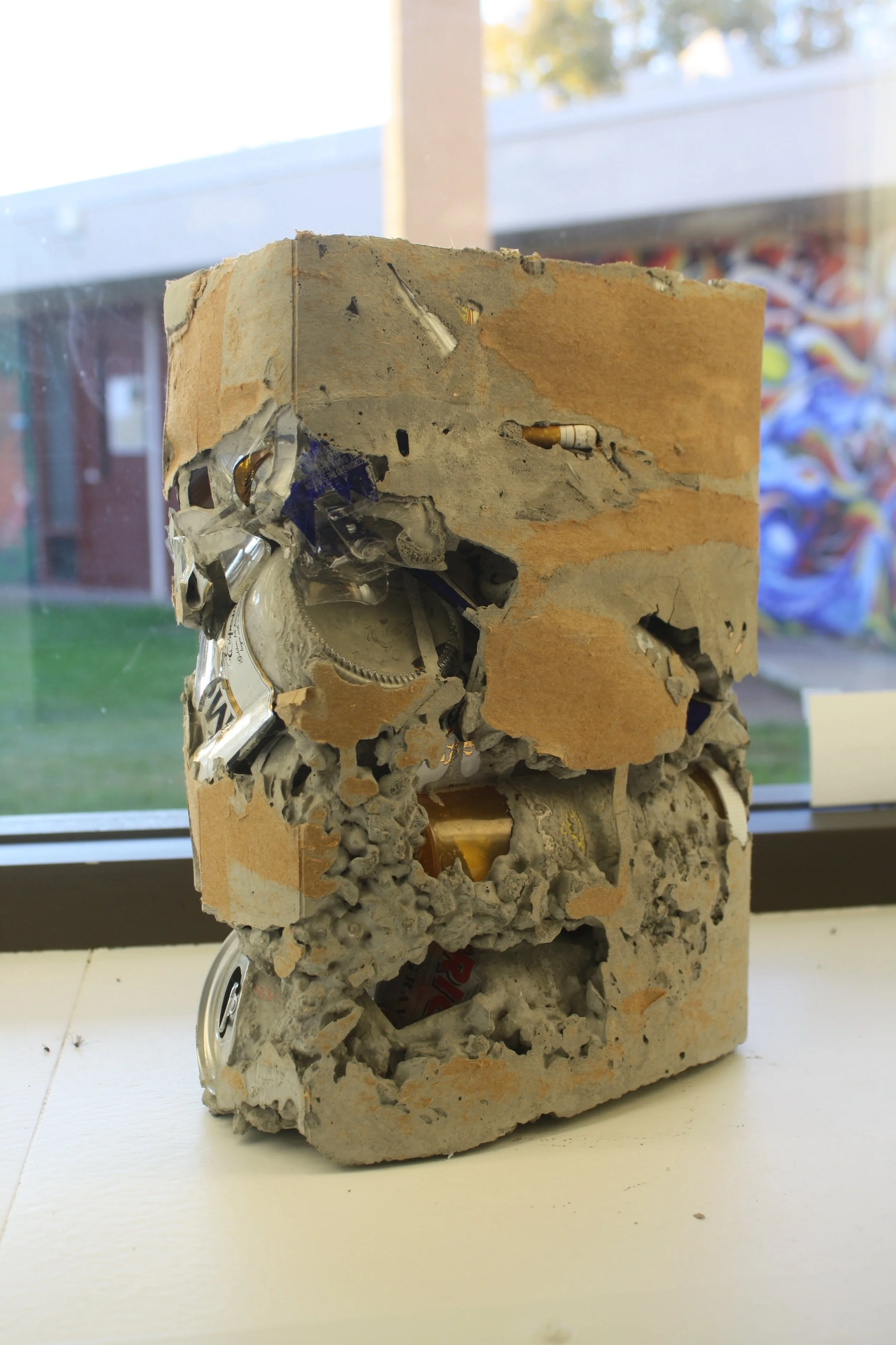 trash in a blook of concrete. 