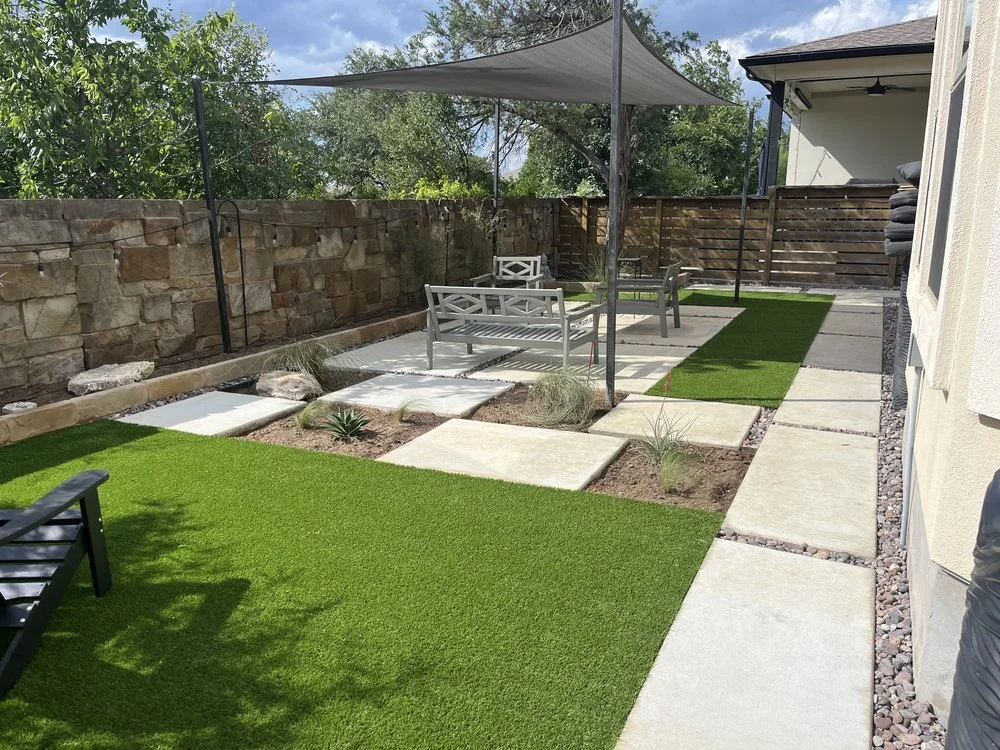 Backyard turf, pavers, sun sails.jpeg