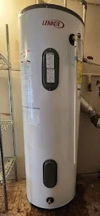 White tank-style water heater with control panel and pipes connected