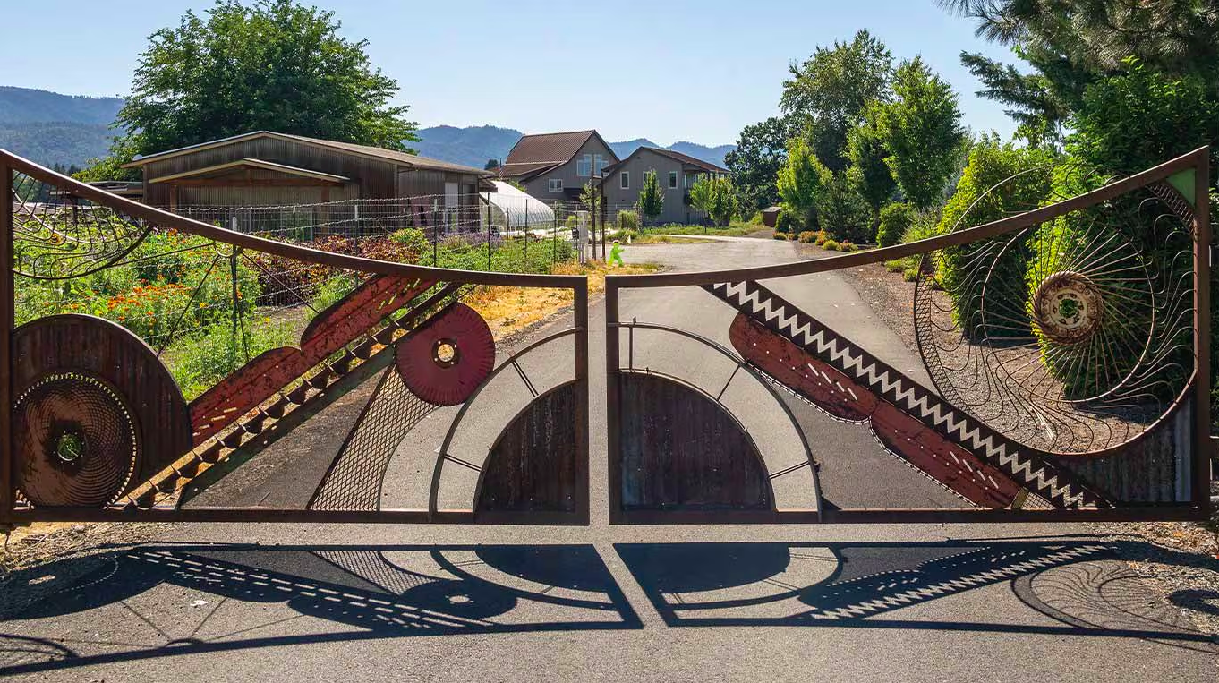 One of the farm's innovative gates, built with old farming tools and parts.