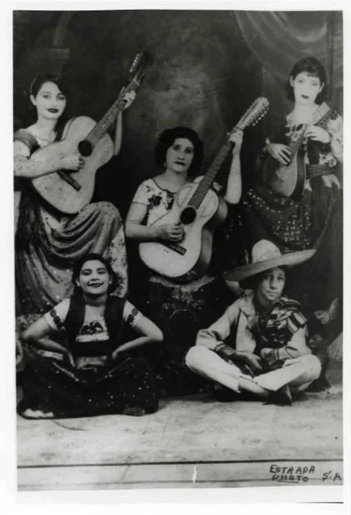  The Mendoza family poses with their instruments, 1935, Lydia Mendoza's mother, Leonor, is in the center. The others identified are Juanita, Manuel, Panchita, and Maria Mendoza.  
