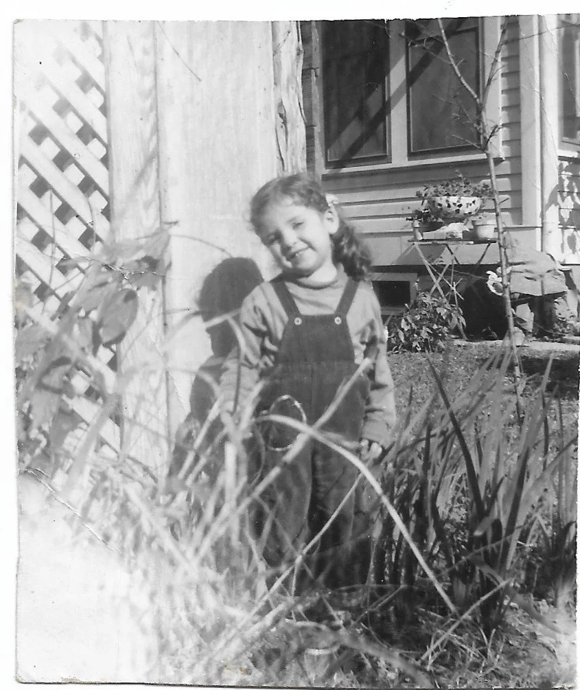 "1955 picture of me, by the weeds in the back yard on Buena Vista. I loved my grandparents' home-- it's where I was taught to 'declamar' long poemas en español."