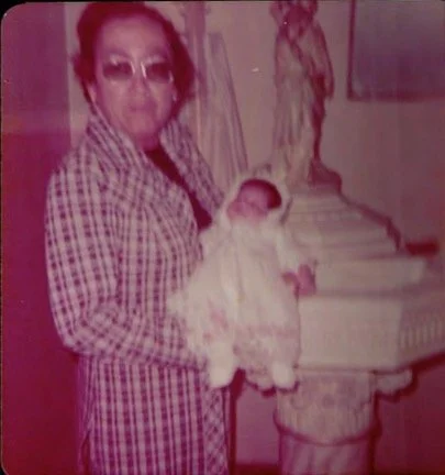 Maria held by her Nina for her baptism. Photo courtesy of Maria A. De la Cruz