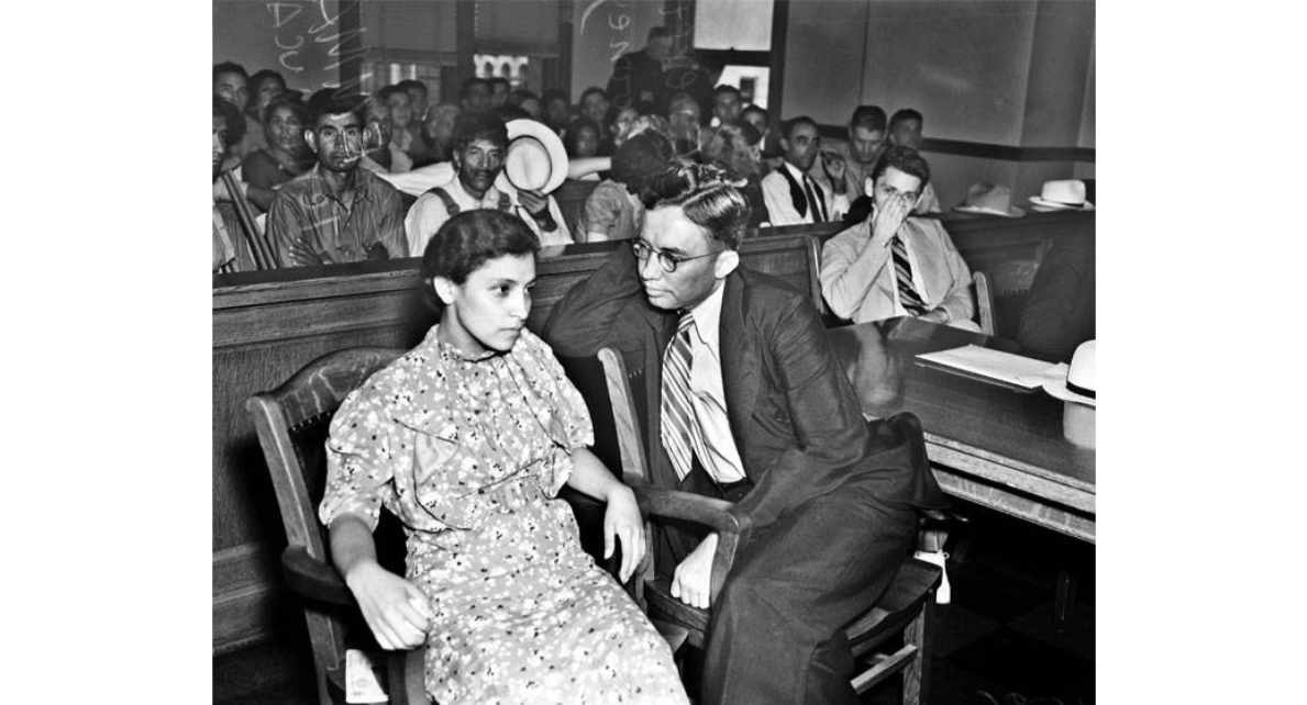 Emma Tenayuca and attorney Everett Looney, In courtroom during trial on charges of unlawful assembly and disturbing the peace, July 13, 1937