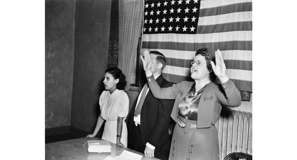 Emma Tenayuca, Homer Brooks, and Elizabeth Benson begin singing the "Star Spangled Banner", During an attempt to open a Communist rally in Municipal Auditorium, San Antonio, Texas, August 25, 1939