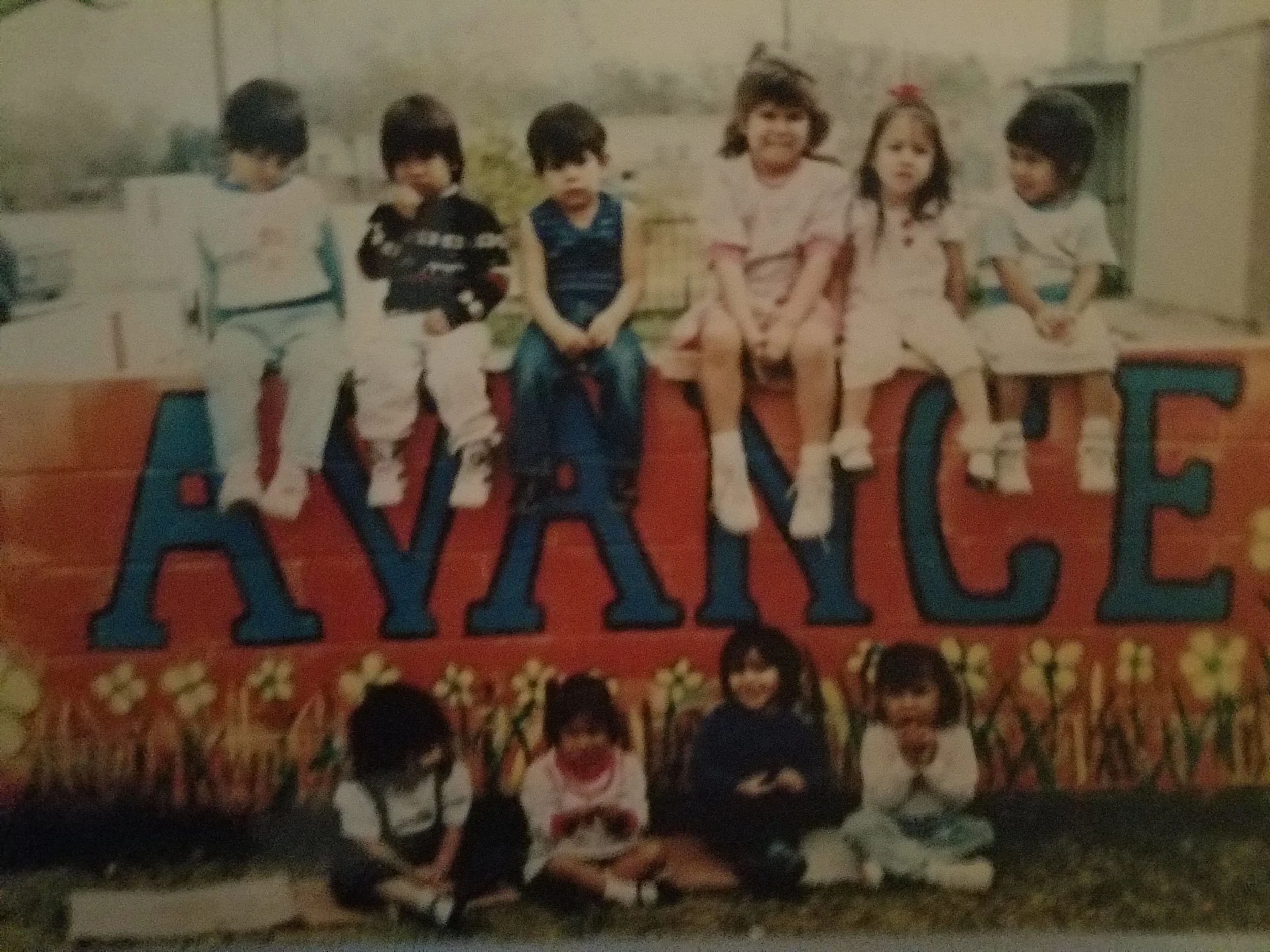 Children sitting on the wall at AVANCE in Mirasol Courts. Photo courtesy of Gloria G. Rodriguez. Not to be republished without her permission. 