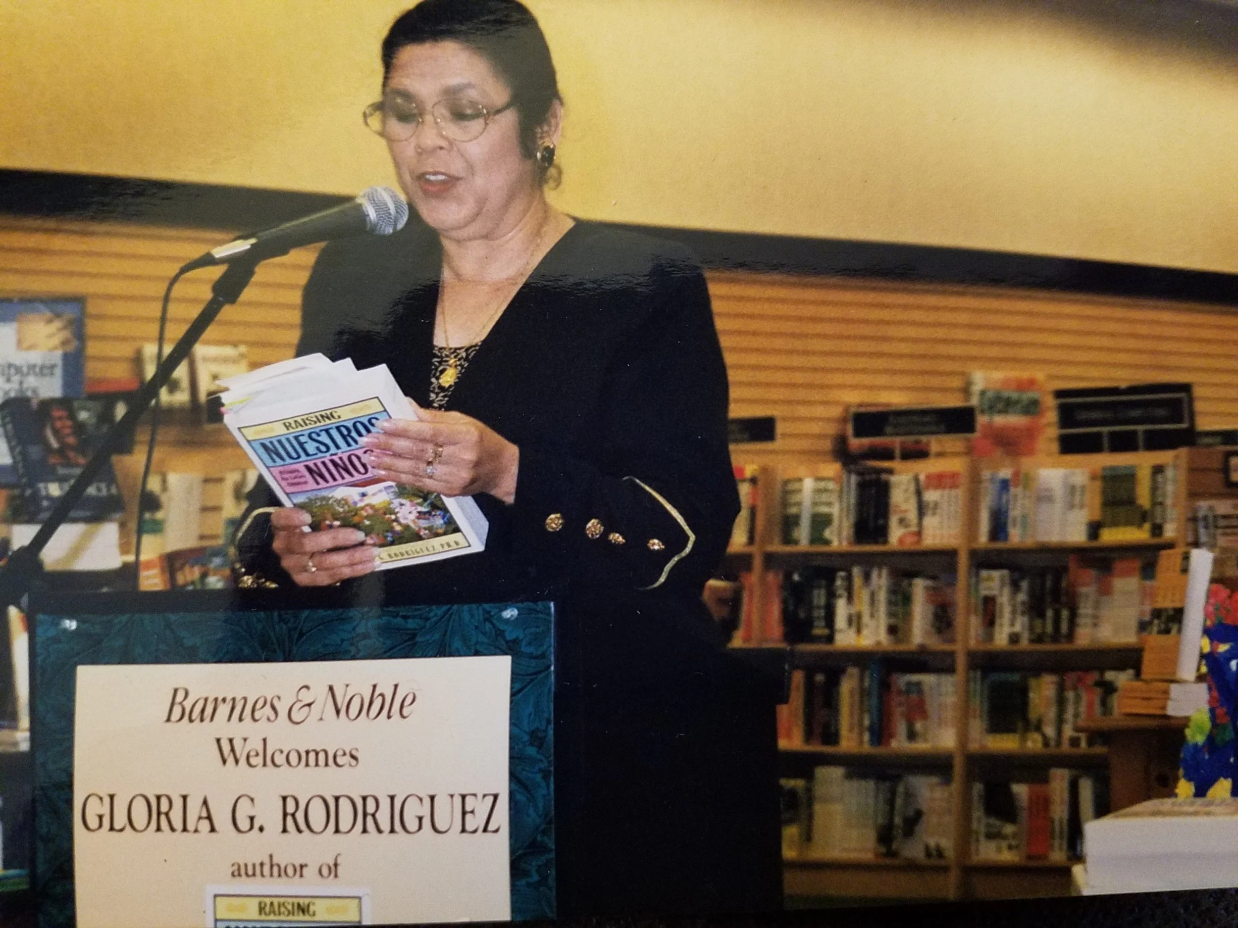 Gloria reading from her book, Raising Nuestros Niños. Photo courtesy of Gloria G. Rodriguez. Not to be republished without her permission. 