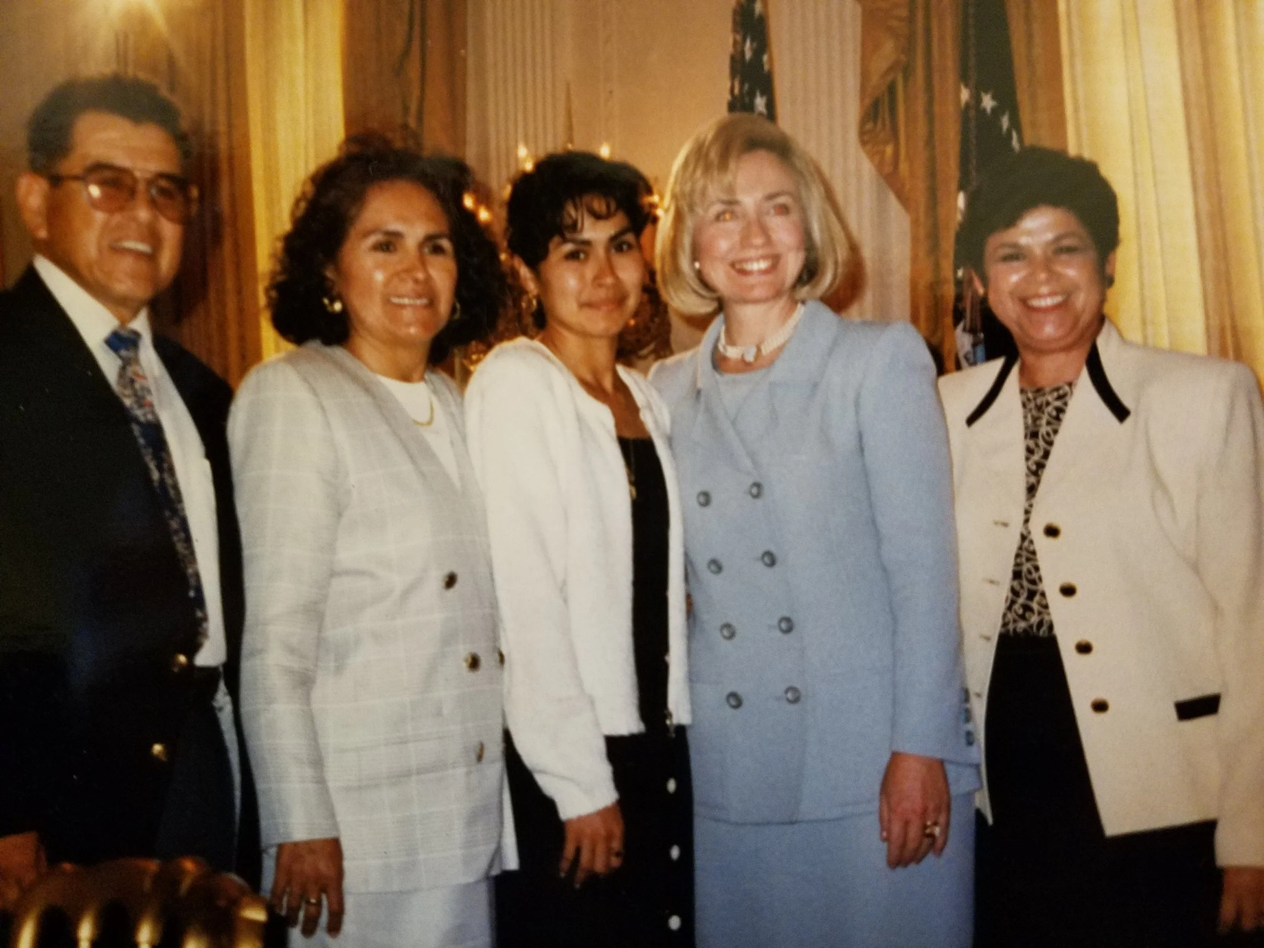  Gloria, standing with First Lady Hillary Clinton and parents with an AVANCE child who became a teacher. AVANCE was recognized as a national early childhood model at the White House twice, in 1997 and 1998. Photo courtesy of Gloria G. Rodriguez. Not 