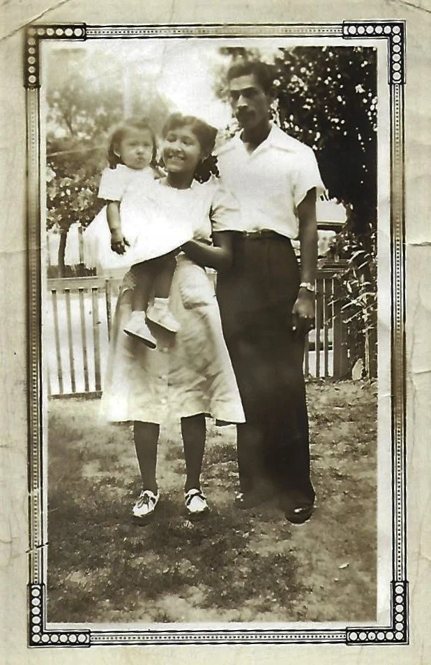 Nickie as a toddler with her father and mother, circa 1943