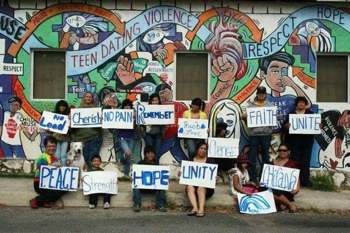 Rodríguez and members of the P.E.A.C.E Initiative in front of "Breaking the Cycle" mural, c. 2002. The mural is no longer at the site. Courtesy of Mary Agnes Rodríguez