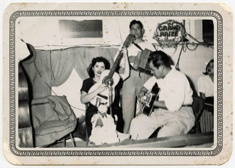 Lydia Mendoza with a Conjunto band, Band includes an accordion, a guitar, and a tololoche. San Antonio, 1950.