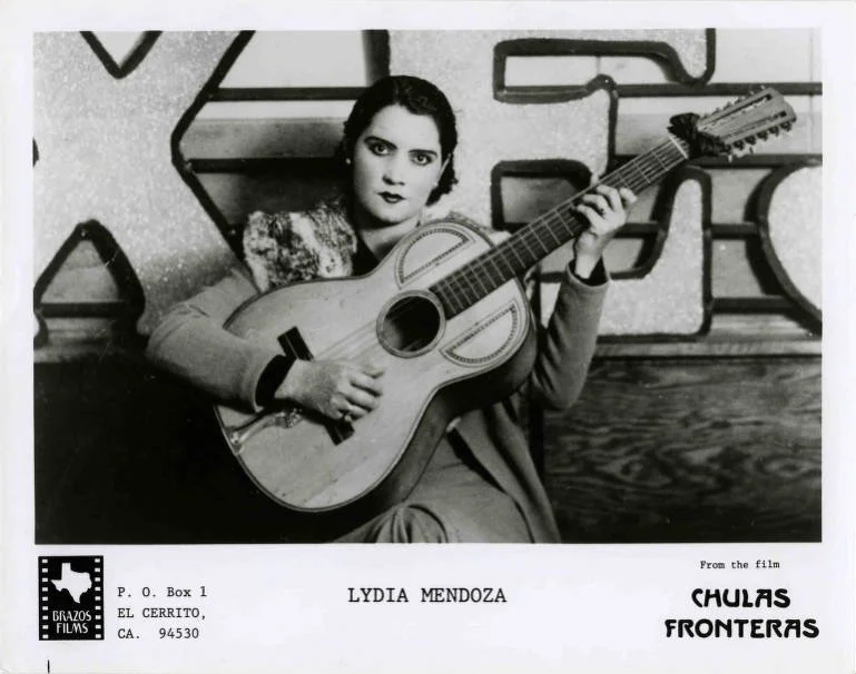 Promotional photograph, originally taken in 1934. Lydia Mendoza with her Bajo sexto, from the film "Chulas Fronteras," 1976.