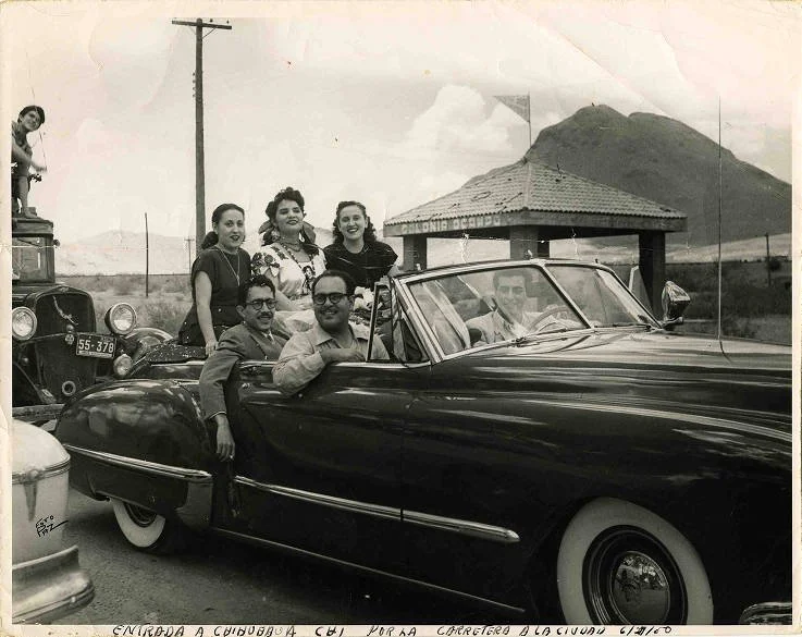 Lydia Mendoza and friends in Chihuahua, Mexico, Lydia Mendoza and friends riding in a car through Chihuahua, Mexico, to be awarded the key to the city, 1950