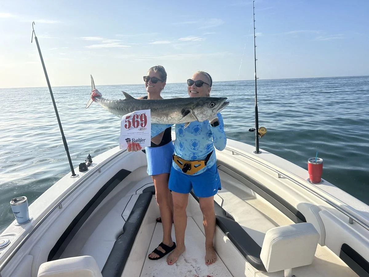 Kingfish Shootout Fishing Tournament showing female fishers and their kingfish.