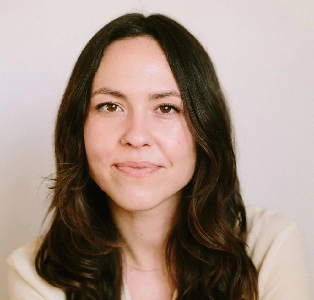 A woman smiling at the camera.
