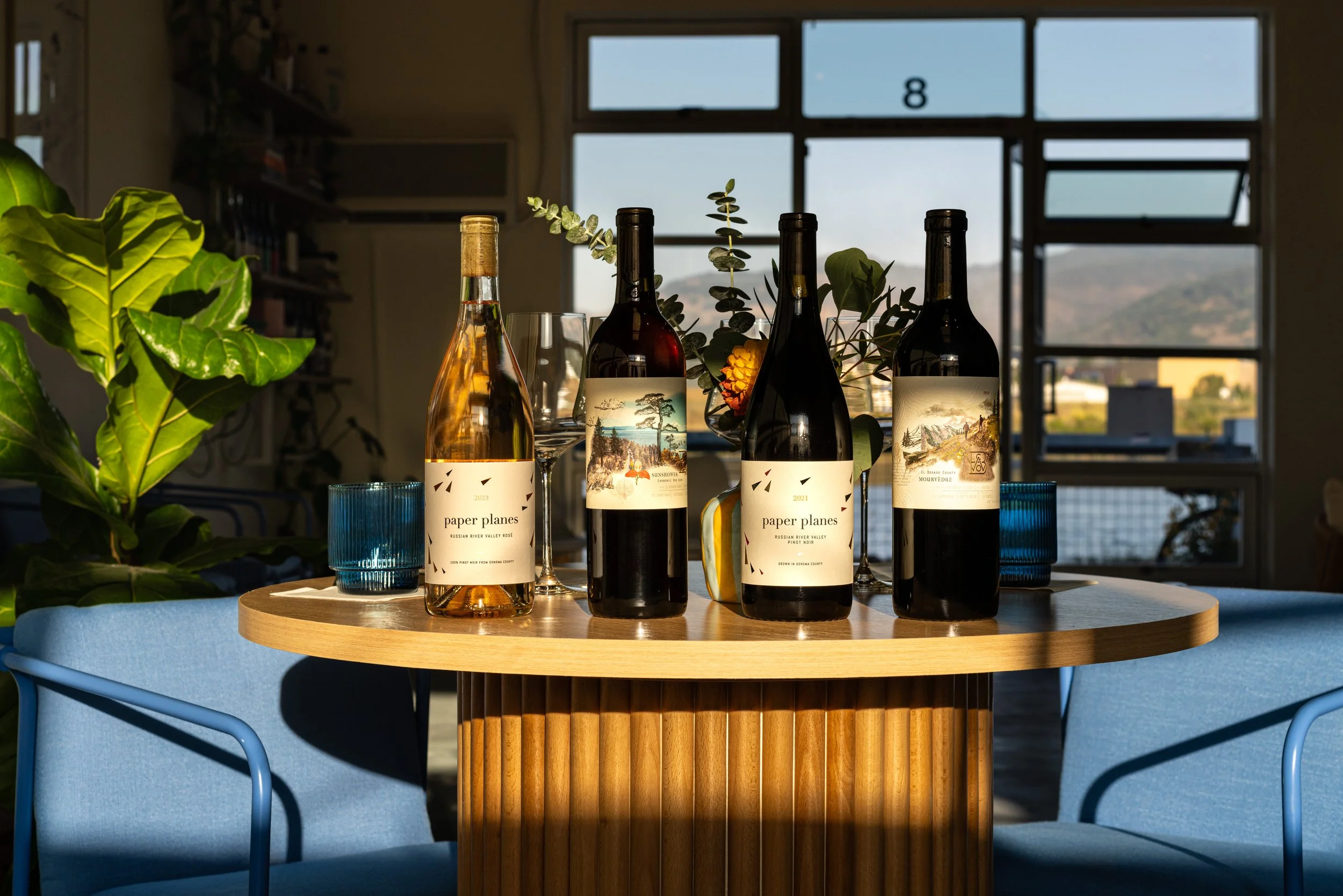 Belong Wine Co. + Paper Planes wines on the table at The River Club Napa.