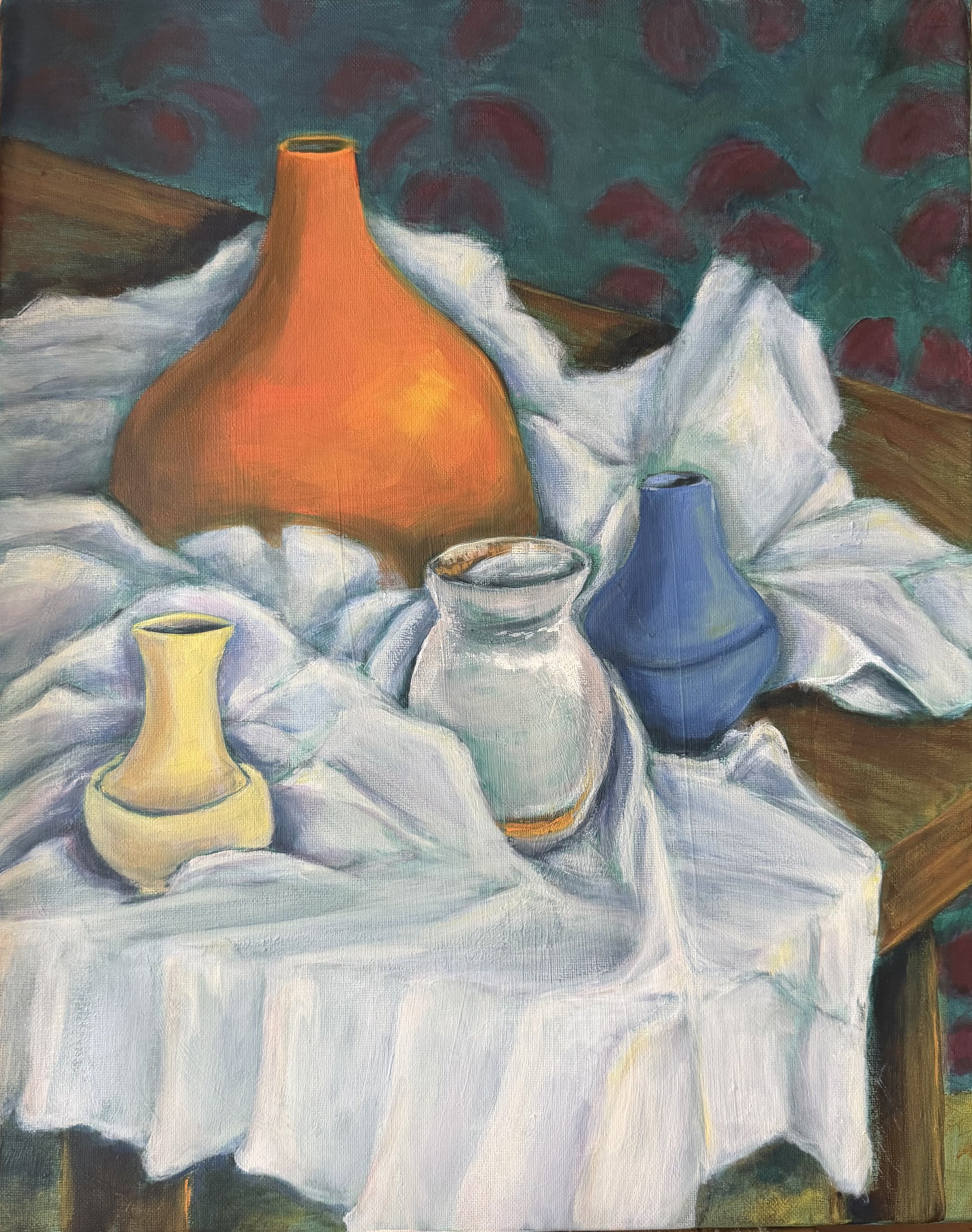 Still life painting of various vases and bowls on a white cloth, with a green and red foliage background.