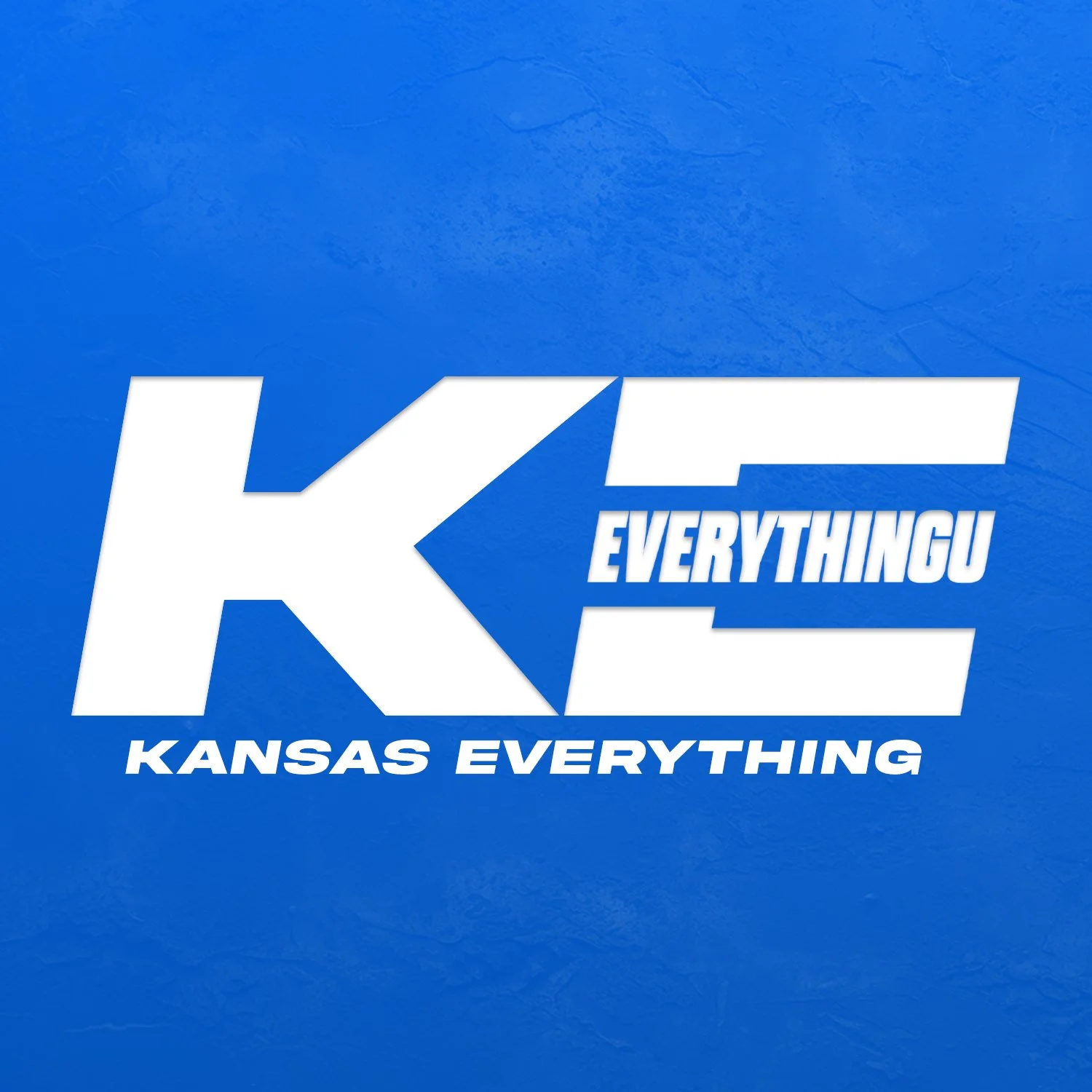 Blue background with large white text saying "KC" and smaller white and blue text saying "Everything" and "Kansas Everything".