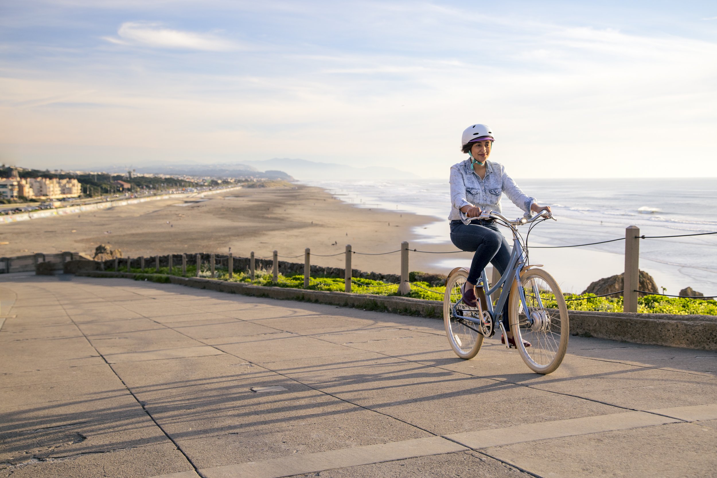 California Commercial Photographer - e-bike San Francisco Ocean Beach PON bikes sunset natural light woman