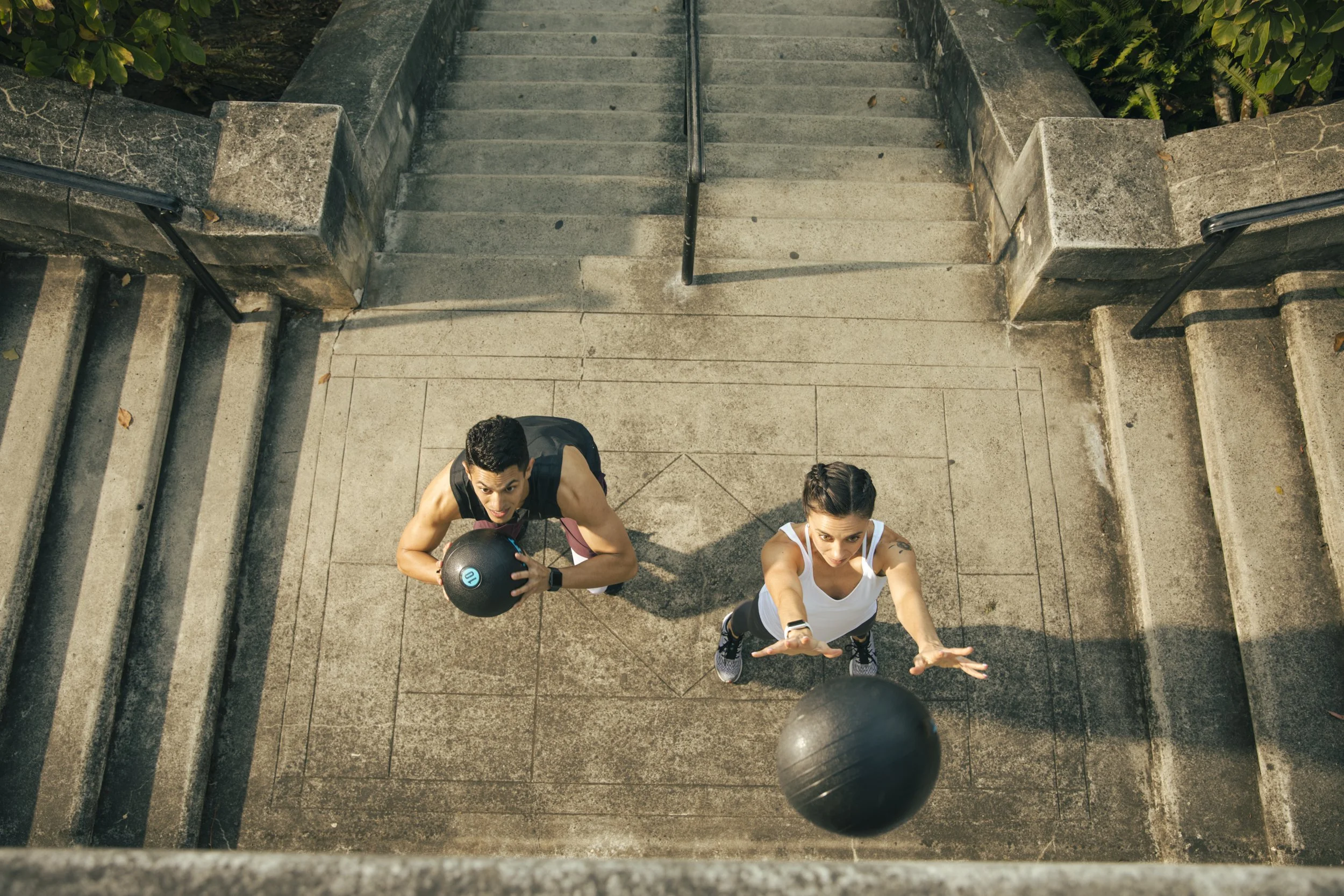 Athletic fitness and training photography by Bay Area commercial photographer Kaare Iverson.  A man and woman working out in an urban setting shot for technology company Future Fit.