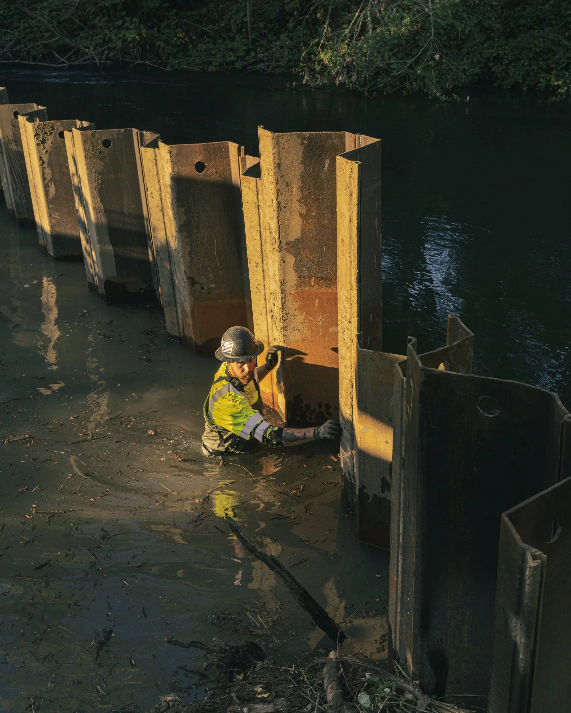 Conservation photography from the gallery THE LAST COHO by California photographer Kaare Iverson - workers install a floodgate at an in-steam enhancement site on Dry Creek in Sonoma County, CA.