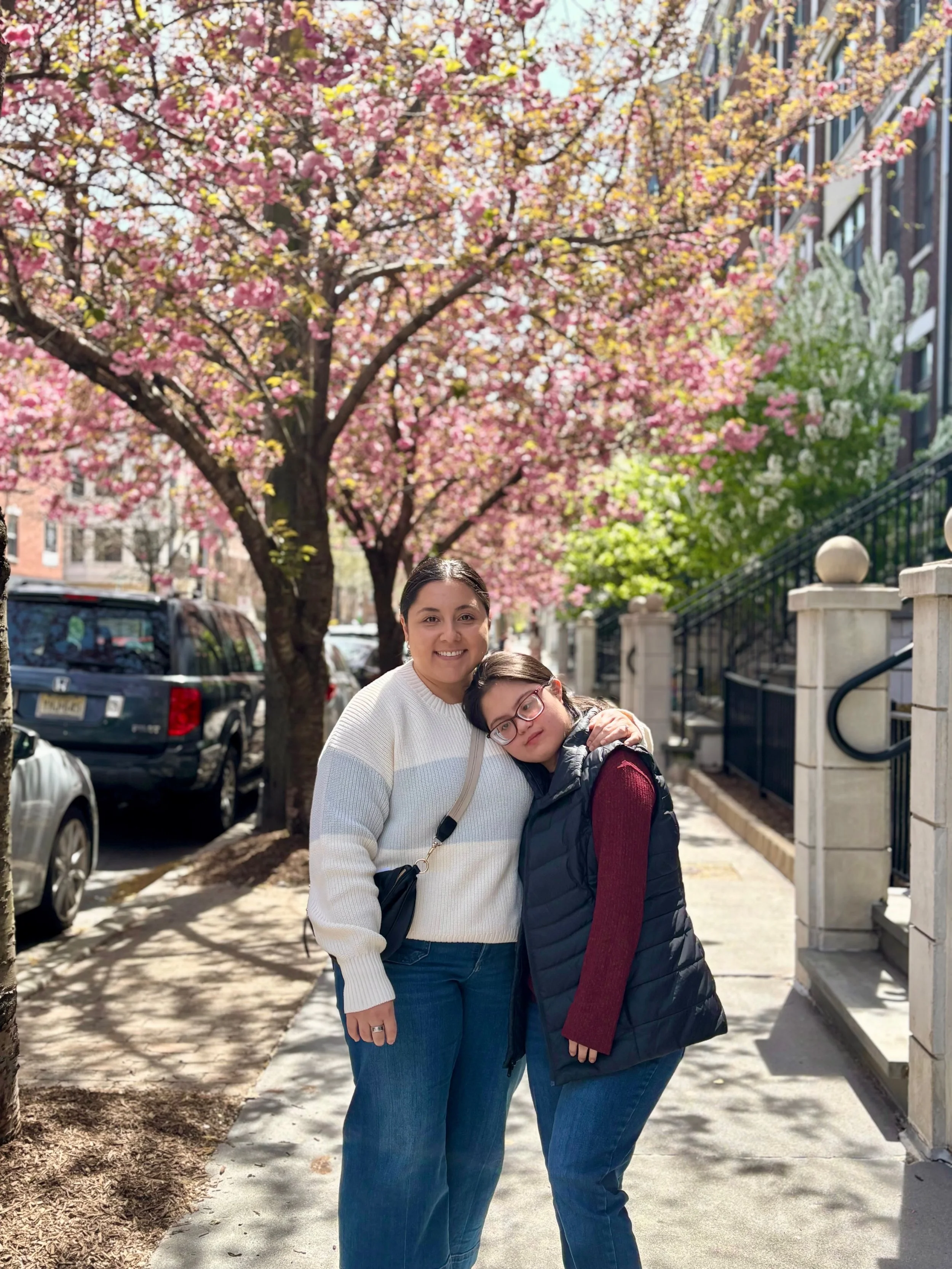 Speech Pathologist, Michelle Nitti, connecting with a young adult client outdoors in Hoboken, NJ.